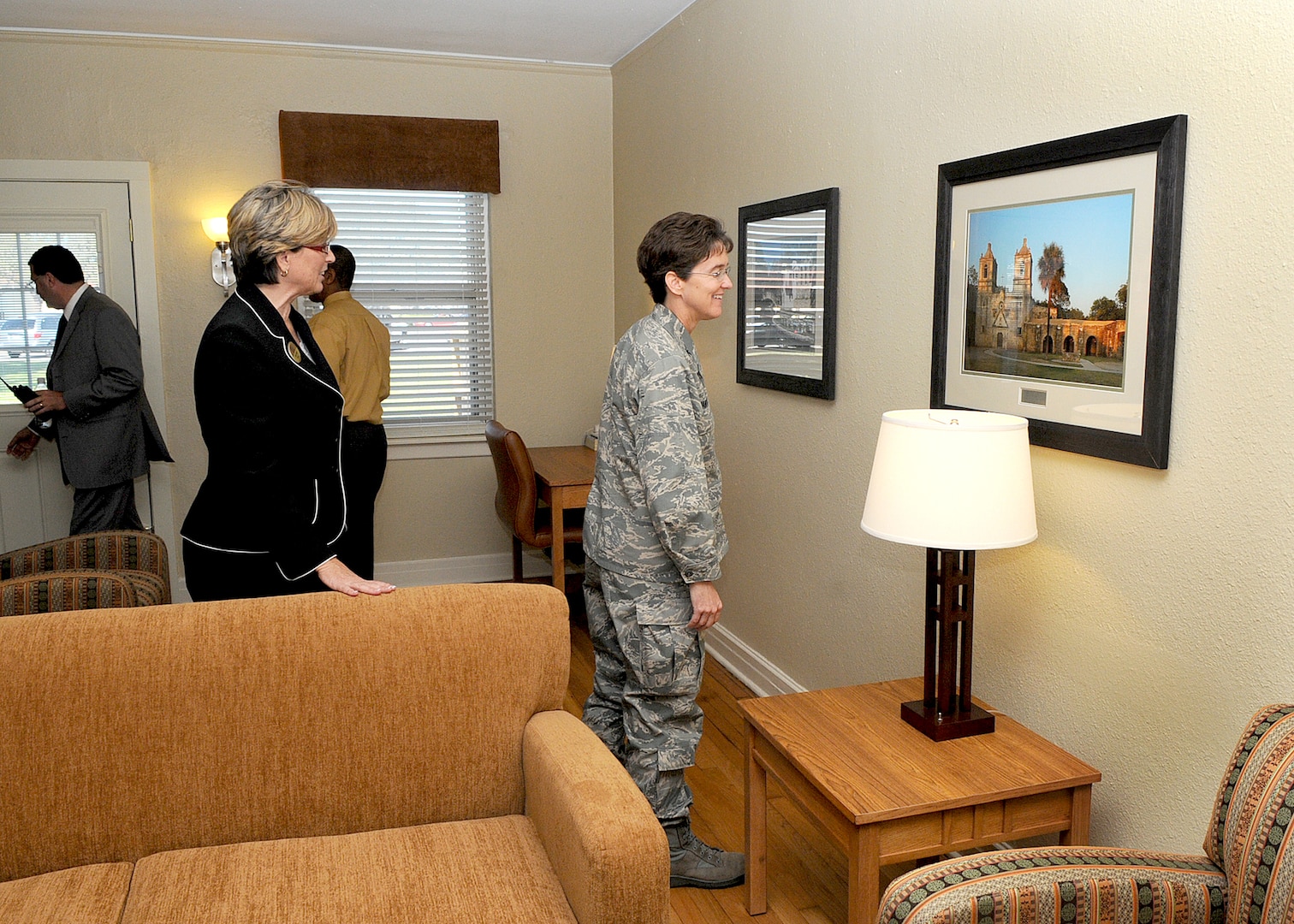 A new Temporary Lodging Facility is inspected by Col. Jacqueline Van Ovost, 12th Flying Training Wing commander, following a ribbon cutting ceremony Nov. 3 at Randolph Air Force Base. On the left is Mary Heagerty, 12th Force Support Squadron director, who hosted the commander to a tour of the newly renovated lodging facility.  (U.S. Air Force photo by David Terry)