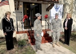 Col. Jacqueline Van Ovost, 12th Flying Training Wing commander, thanks members of Air Force Lodging and various contractors for their efforts to complete the new temporary lodging facility at Randolph Air Force Base, during a ribbon cutting ceremony on Nov. 3. In the photo from left are Mary Heagerty, 12th Force Support Squadron director, Colonel Van Ovost, Maj. Todd Alcott, Air Force Lodging chief, and Mary Eddy, 12th FSS lodging manager. (U.S. Air Force photo by David Terry)