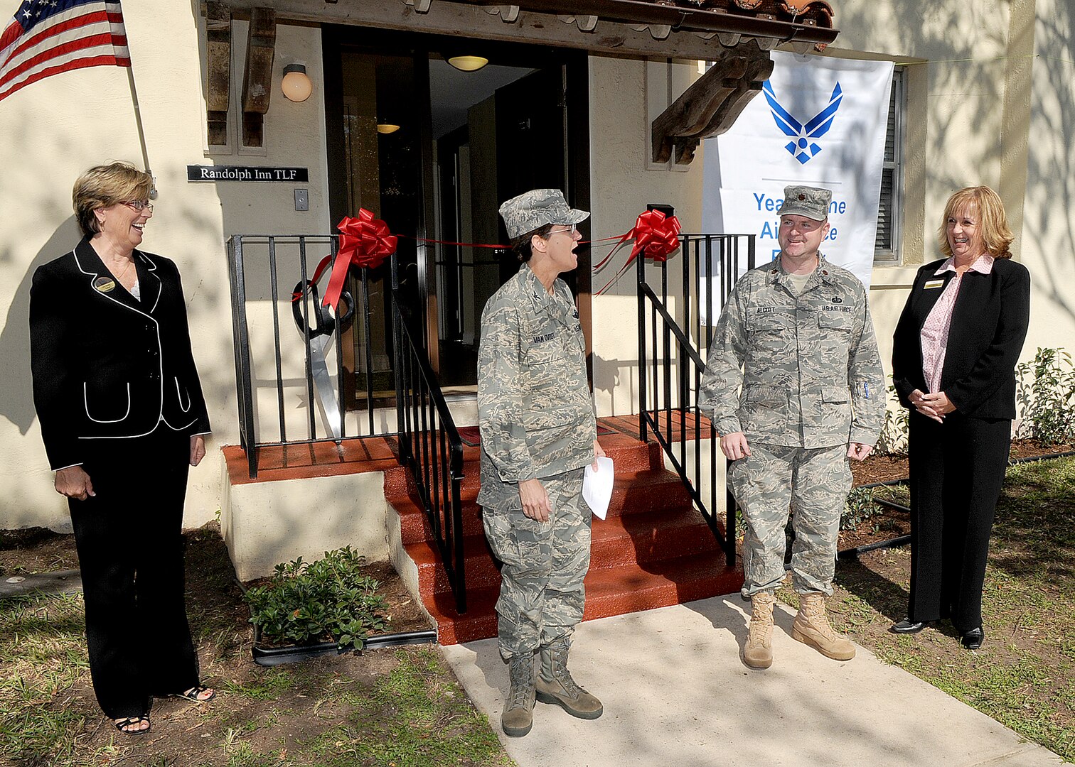 Col. Jacqueline Van Ovost, 12th Flying Training Wing commander, thanks members of Air Force Lodging and various contractors for their efforts to complete the new temporary lodging facility at Randolph Air Force Base, during a ribbon cutting ceremony on Nov. 3. In the photo from left are Mary Heagerty, 12th Force Support Squadron director, Colonel Van Ovost, Maj. Todd Alcott, Air Force Lodging chief, and Mary Eddy, 12th FSS lodging manager. (U.S. Air Force photo by David Terry)