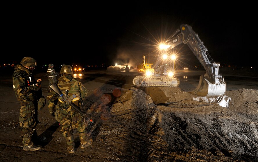 Airmen from the 51st Civil Engineer Squadron use heavy equipment to repair a runway crater after a simulated missile attack during operational readiness exercise Beverly Midnight 09-02, Nov. 3, at Osan Air Base, Republic of Korea. (U.S. Air Force photo/Staff Sgt. Brian Ferguson




