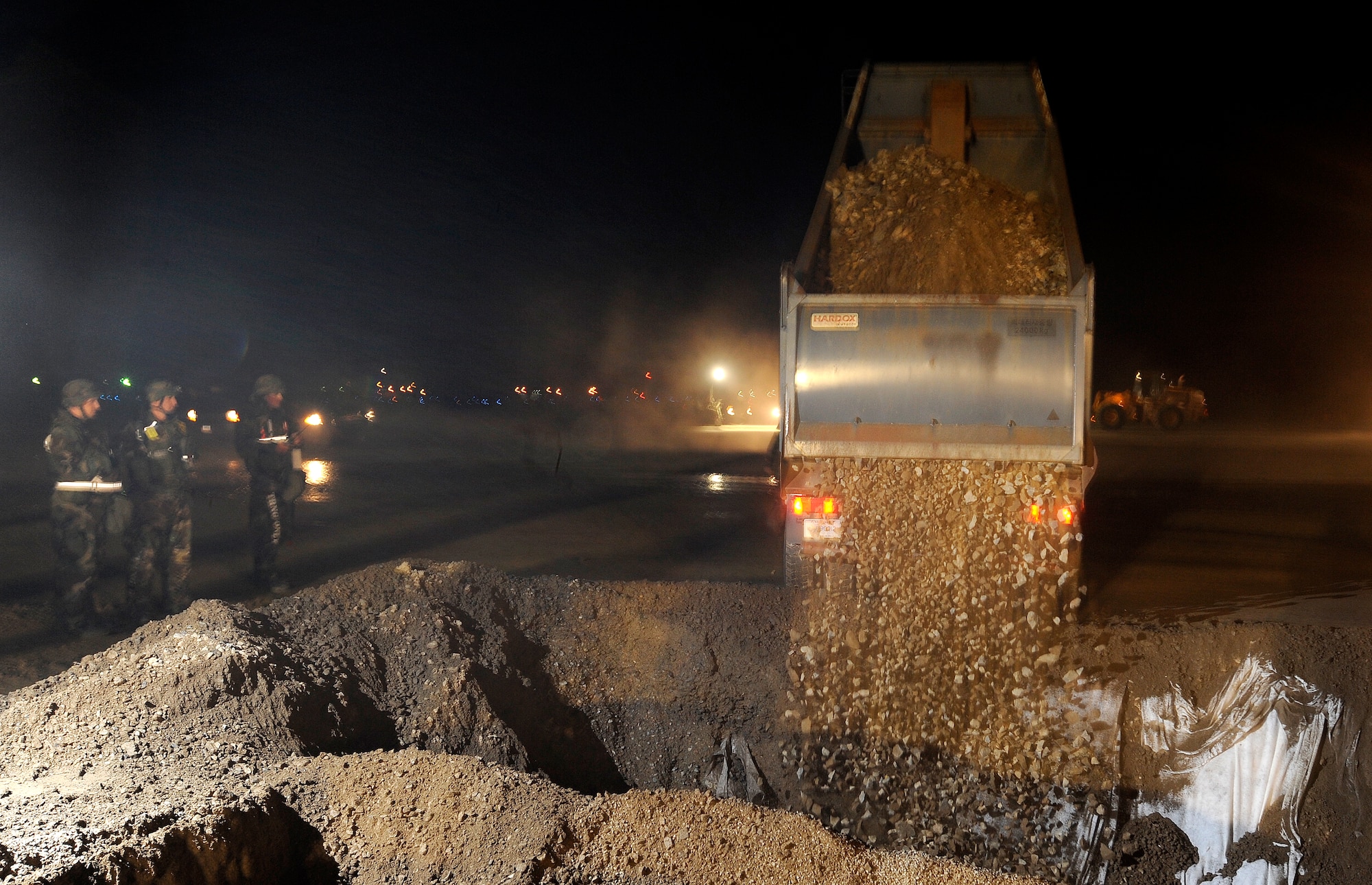 Airmen from the 51st Civil Engineer Squadron use heavy equipment to repair a runway crater after a simulated missile attack during operational readiness exercise Beverly Midnight 09-02, Nov. 3, at Osan Air Base, Republic of Korea. (U.S. Air Force photo/Staff Sgt. Brian Ferguson




