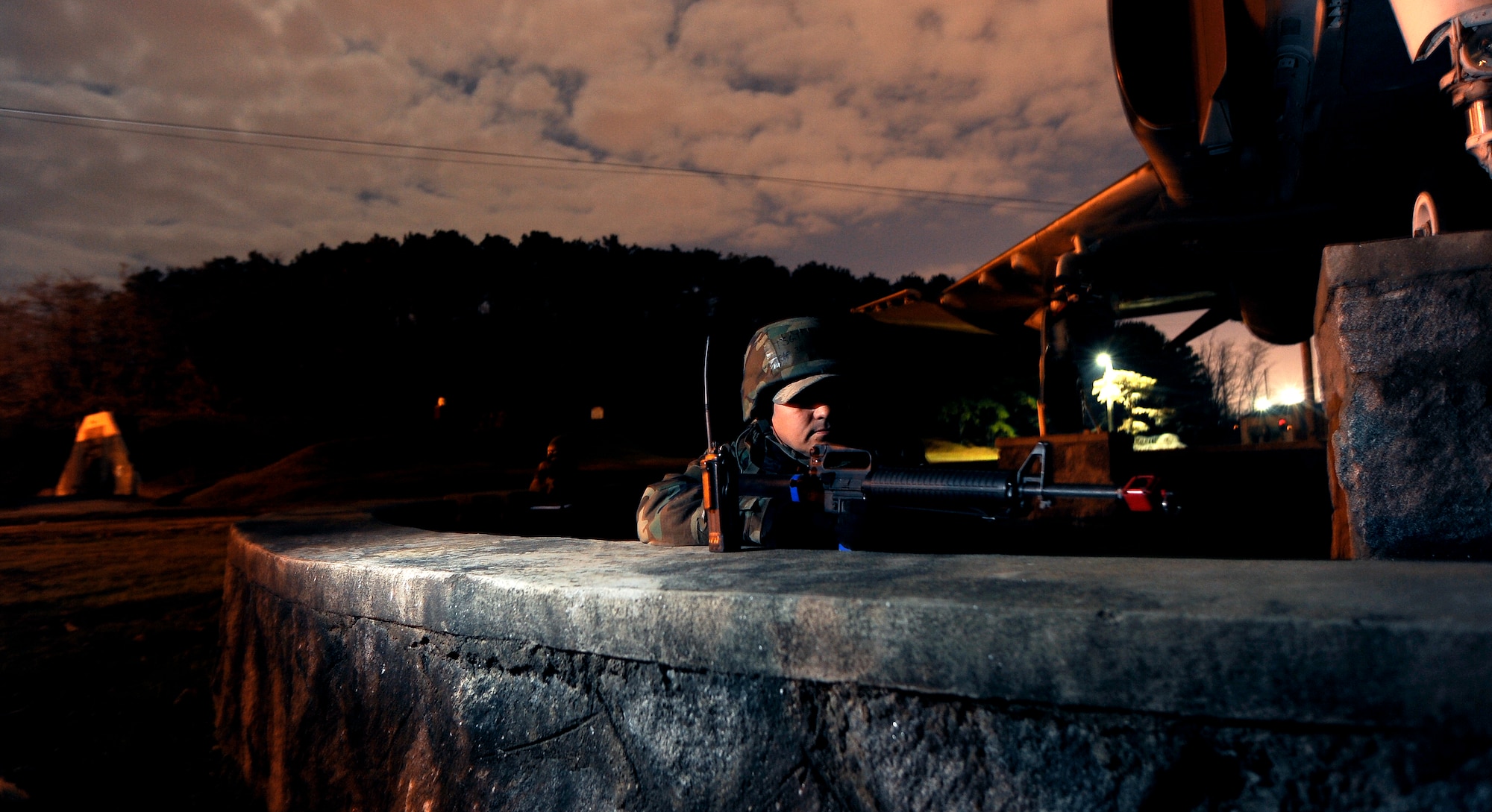 Tech. Sgt. Joseph Marcum takes cover and secures the area during a simulated ground attack, part of operational readiness exercise Beverly Midnight 09-02, Nov. 3, at Osan Air Base, Republic of Korea.  Sergeant Marcum is assigned to the 51st Civil Engineer Squadron.(U.S. Air Force photo/Staff Sgt. Brian Ferguson)




