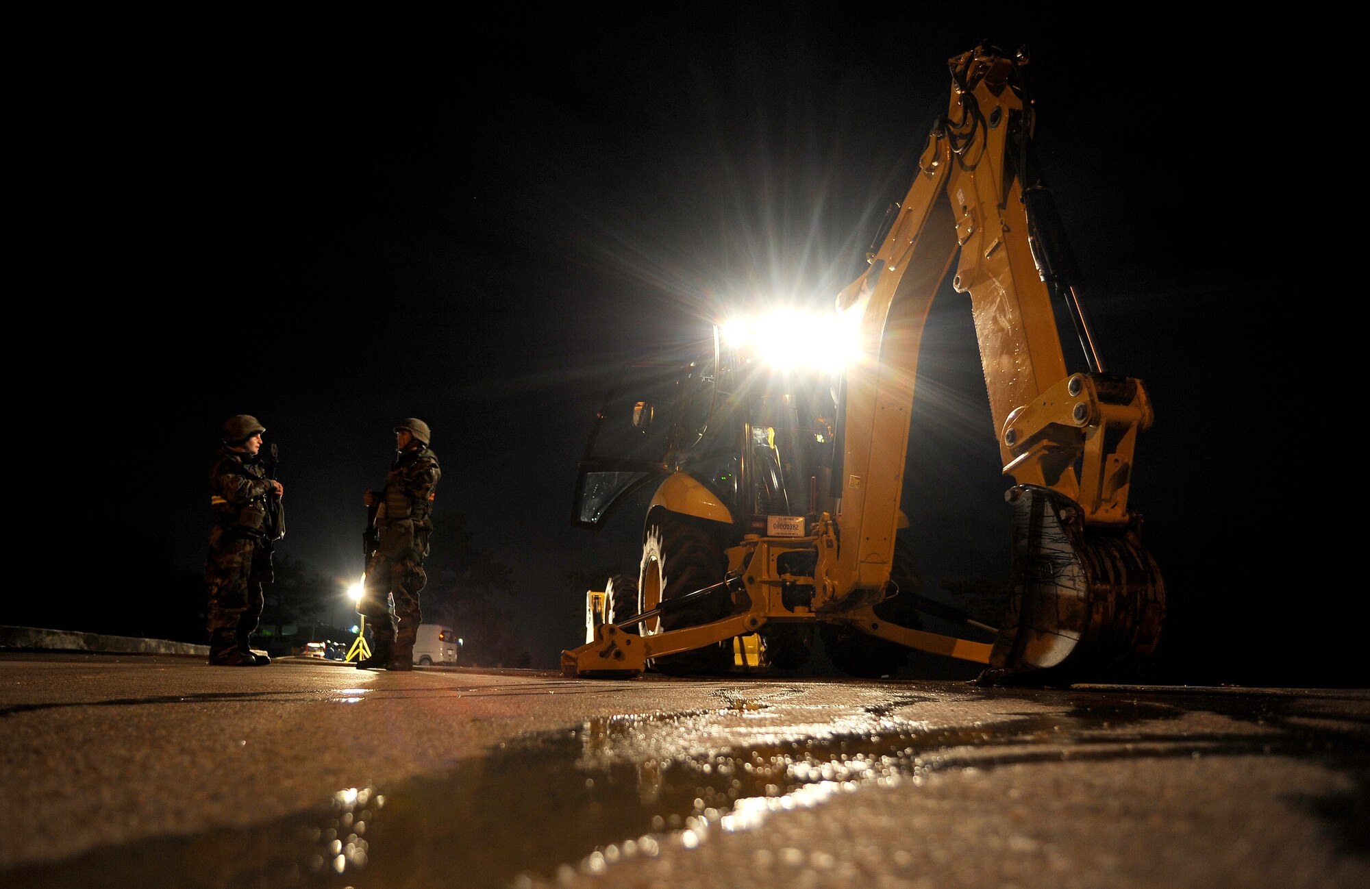 Senior Airman Tyler Peterson, left, and Staff Sgt. Ronnie Aguftin discuss the course of action after a simulated water main rupture near the flightline during operational readiness exercise Beverly Midnight 09-02, Nov. 3, at Osan Air Base, Republic of Korea.  Airman Peterson and Sergeant Aguftin are assigned to the 51st Civil Engineer Squadron. (U.S. Air Force photo/Staff Sgt. Brian Ferguson)





