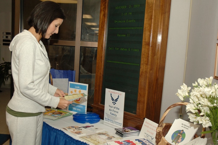 Annette Gray browses through free educational materials for parents with children up to 17 years old at the Airman and Family Readiness Center here as part of the Air Force Family Week celebration Nov 2. President Barack Obama recently named November as Military Family Month, and as part of the Air Force's Year of the Air Force family, the materials focus on military-connected children and their educational needs. Annette is the wife of Capt. Donald Gray who is with the 437th Maintenance Squadron. (U.S. Air Force photo/Staff Sgt. Marie Brown)