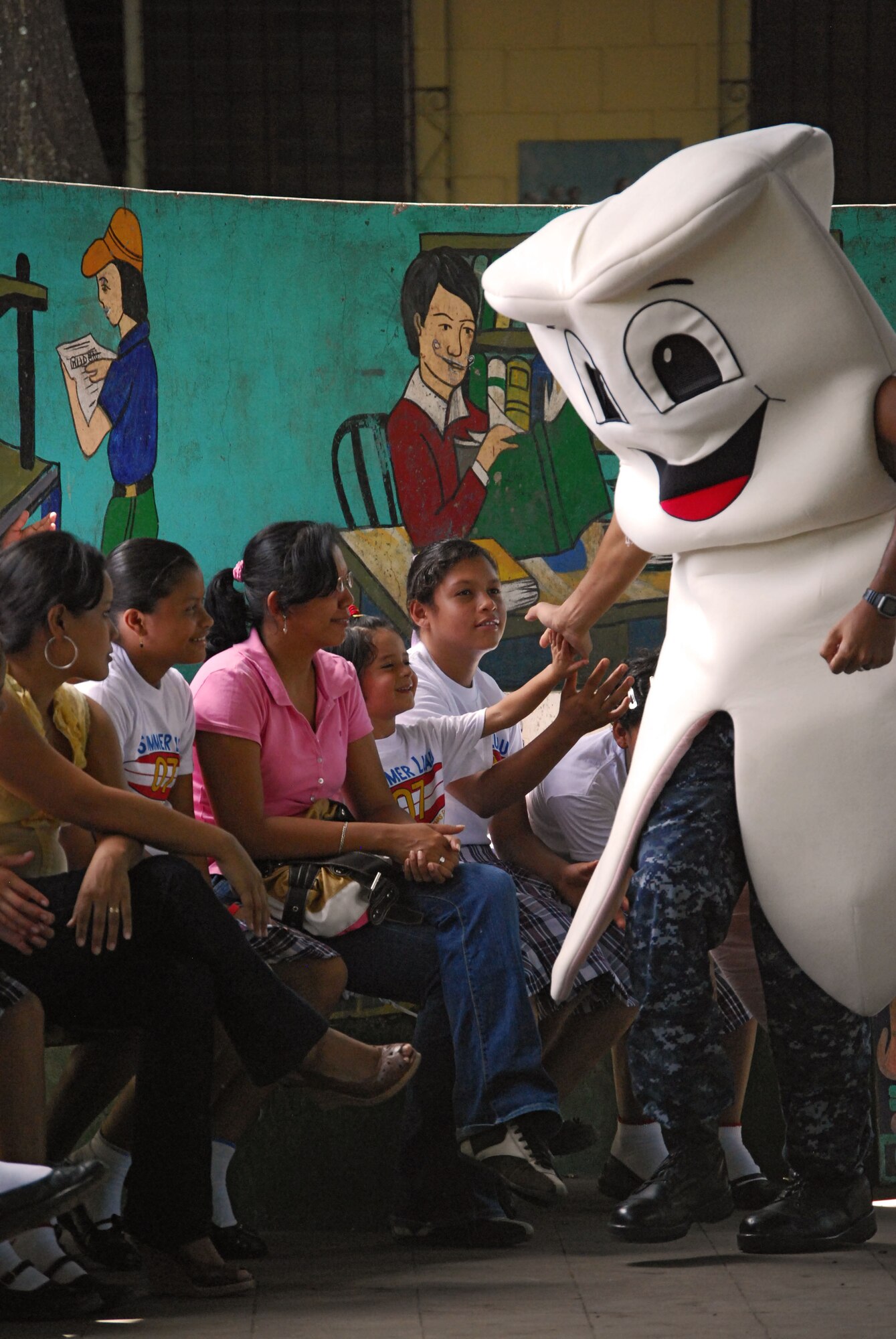 Corinto-Nicaragua-"Senor Toothy", the large costumed molar played by the ship's oral hygiene educator, makes an appearance at a AFSOUTH Band concert and teaches children about the importance of oral health.