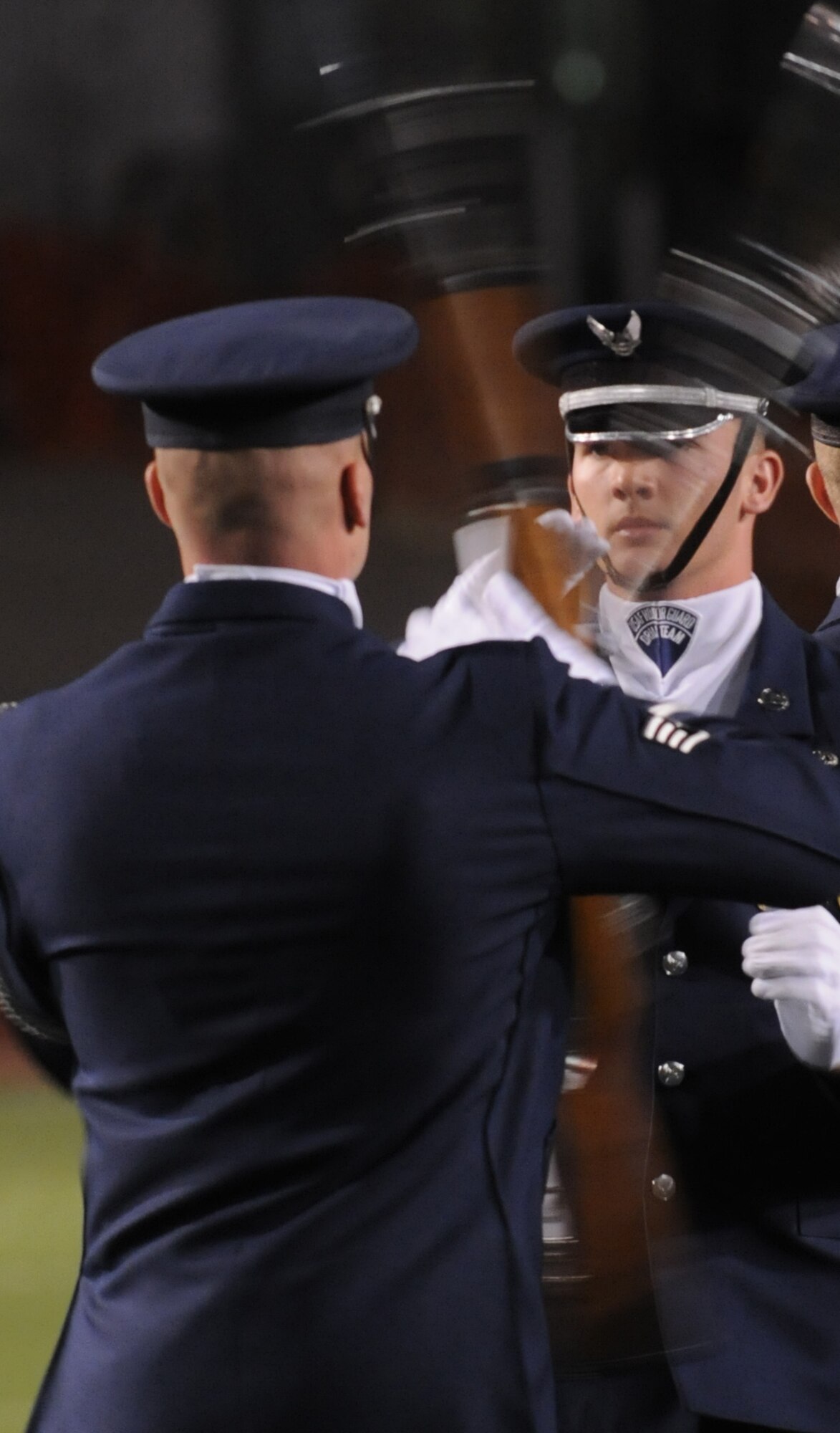 Staff Sgt. Kelly Webster of the United States Air Force Honor Guard Drill Team performs at halftime at an Angelo State University football game Oct. 31 in San Angelo, Texas. The Drill Team tours worldwide representing all Airmen while showcasing Air Force precision and professionalism and personifying the integrity, discipline, and teamwork of every Airman and every Air Force mission. During the Air Force Honor Guard's 60-year history, their traveling component, the Drill Team, has performed in every state of the union and many countries abroad. (U.S. Air Force photo by Senior Air man Sean Adams) 