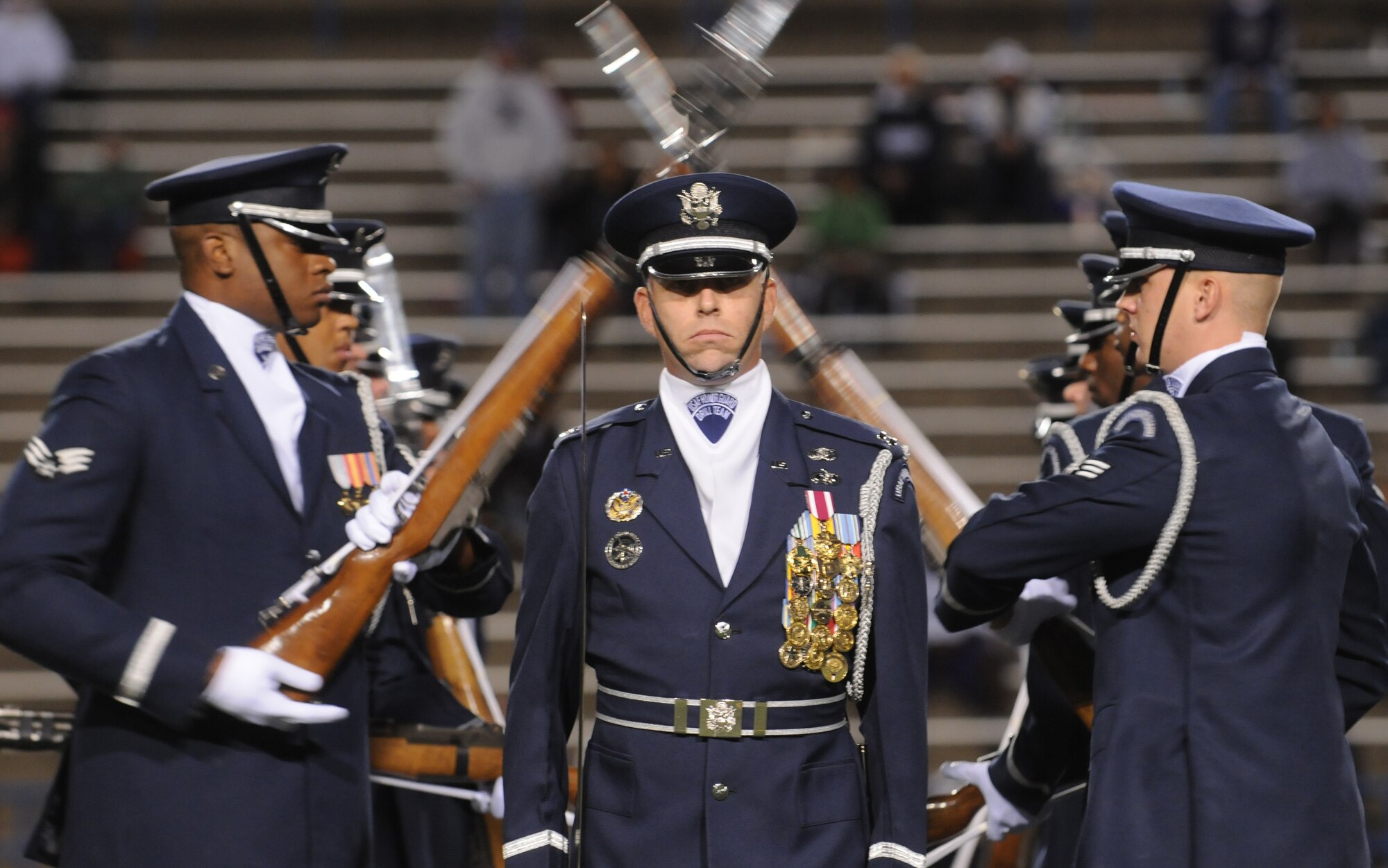 The United States Air Force Honor Guard Drill Team performs at halftime at an Angelo State University football game Oct. 31 in San Angelo, Texas.  The Drill Team tours worldwide representing all Airmen while showcasing Air Force precision and professionalism and personifying the integrity, discipline, and teamwork of every Airman and every Air Force mission. During the Air Force Honor Guard's 60-year history, their traveling component, the Drill Team, has performed in every state of the union and many countries abroad. (U.S. Air Force photo by Senior Airman Sean Adams) 