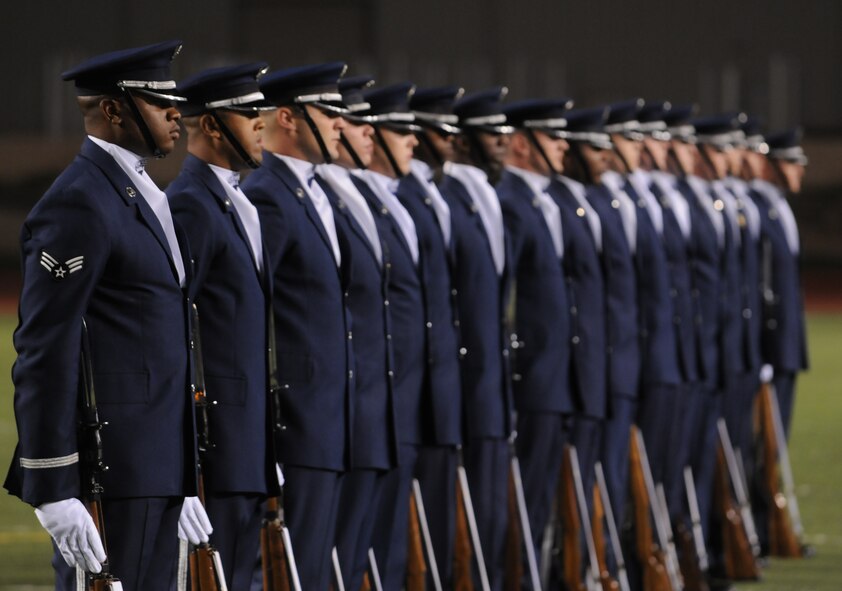 The United States Air Force Honor Guard Drill Team performs at halftime at an Angelo State University football game Oct. 31 in San Angelo, Texas.  The Drill Team tours worldwide representing all Airmen while showcasing Air Force precision and professionalism and personifying the integrity, discipline, and teamwork of every Airman and every Air Force mission. During the Air Force Honor Guard's 60-year history, their traveling component, the Drill Team, has performed in every state of the union and many countries abroad. (U.S. Air Force photo by Senior Airman Sean Adams) 