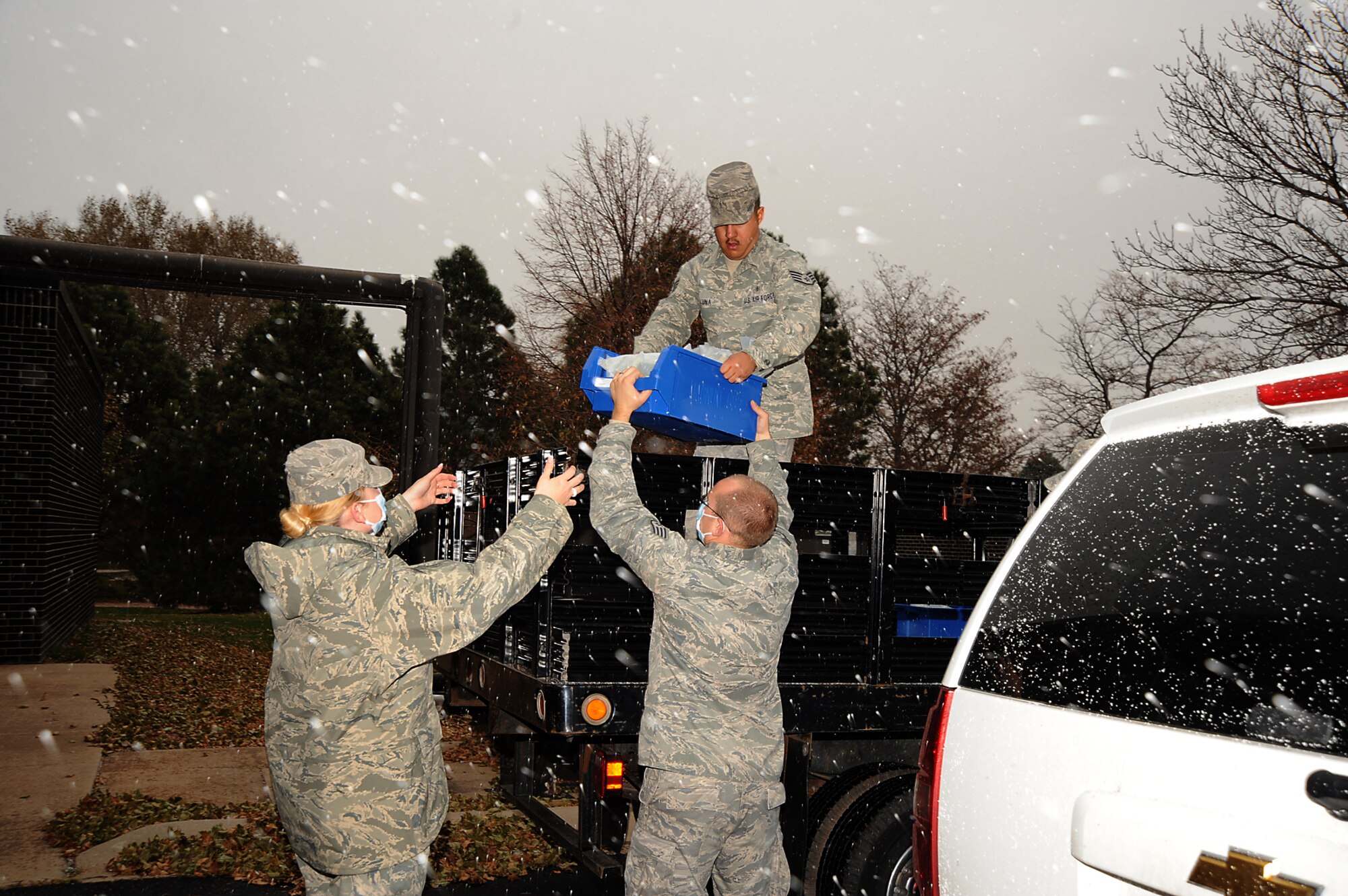 Members of the 21st Medical Group unload supplies at the Aerospace Physiological Unit during the Condor Crest exercise Oct. 28. Medical supplies and equipment were used during scenarios to challenge medical team members' ability to respond to medical emergencies. Condor Crest ran from Oct. 26 - Oct. 29. The 21st Space Wing conducts Condor Crest exercises on a quarterly basis to evaluate readiness. (Air Force photo by Roberta McDonald)

