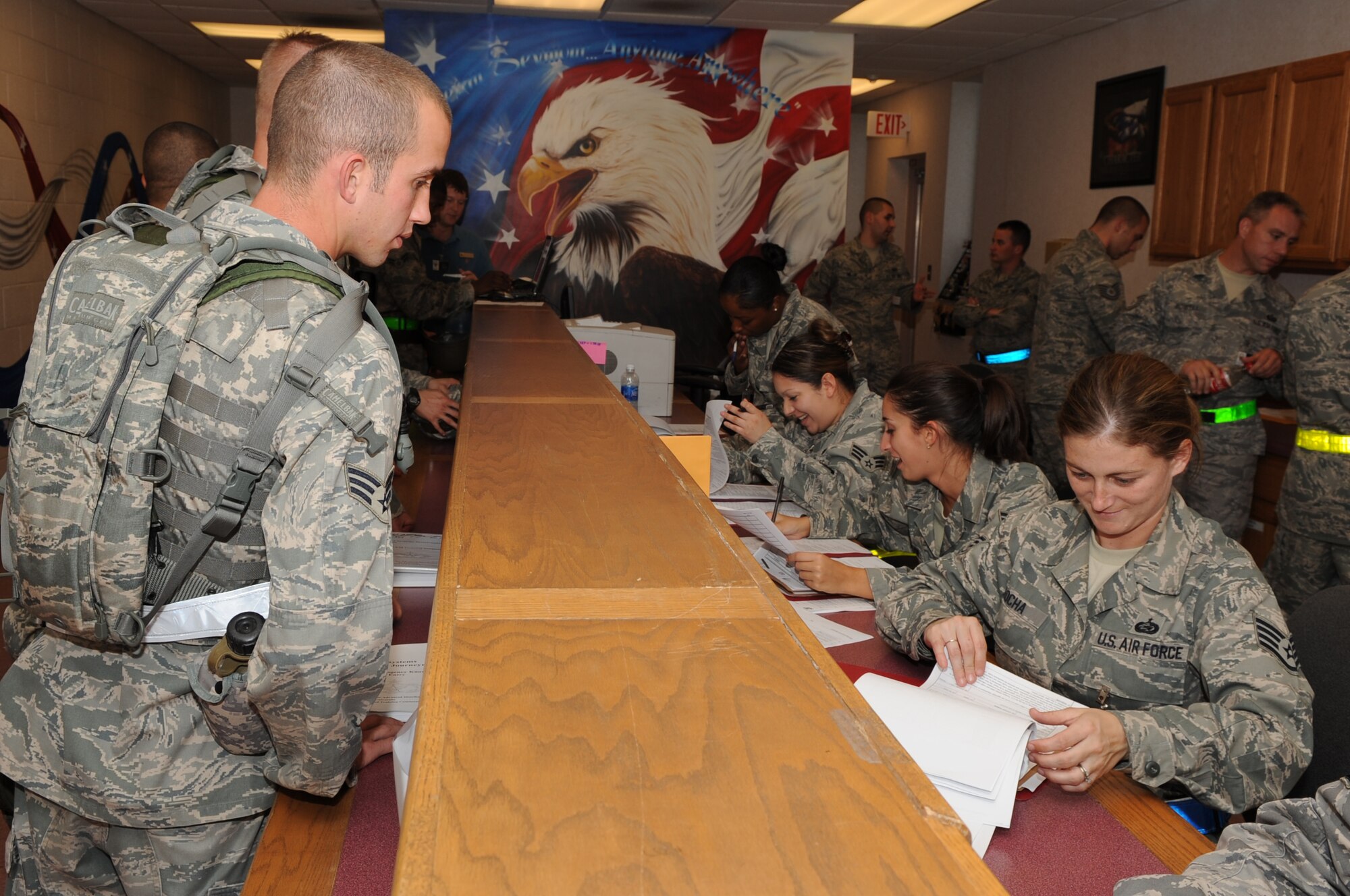 Airmen from the 4th Force Support Squadron review deployment records during the 4th Mission Support Group Phase I exercise at Seymour Johnson Air Force Base, N.C., Nov. 2, 2009. The Airmen have their deployment records reviewed to ensure all information is correct and all training is up to date, to maintain deployment readiness. (U.S. Air Force photo/Senior Airman Courtney Richardson)
