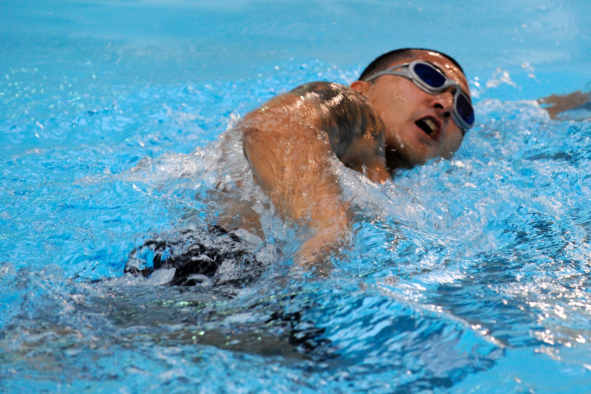 Tech. Sgt. Les Ueda, Air Force Space Command, gets fit-to-fight during lap swimming at the Peterson Air Force Base pool. Swimming is a low-impact exercise available at Peterson’s Aquatics Center, and can help Airmen prepare for the new Air Force fitness culture. Lap swim is available 5:30 to 9 a.m., 11 a.m. to 1 p.m. and 5 to 6 p.m. Monday to Friday, and 10:30 a.m. to noon Saturdays. Call 556-4608 for a full swim schedule. (U.S. Air Force photo by Craig Denton)