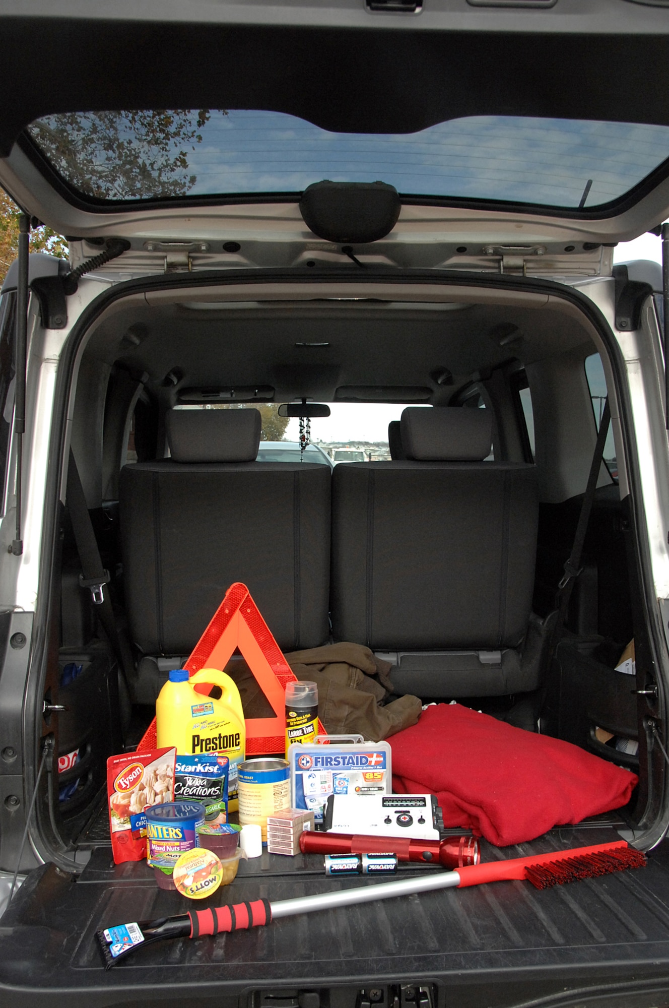 OFFUTT AIR FORCE BASE, Neb. - An emergency safety kit complete with a flash light, batteries, food, a first aid kit, blanket and other necessary items is displayed in the back of a Honda Element in the parking lot outside Bldg. 88 here Nov. 2. With the winter months rapidly approaching, members of Team Offutt are highly encouraged to ensure their vehicles, homes and themselves are prepared. U.S. Air Force Photo by Kendra Williams