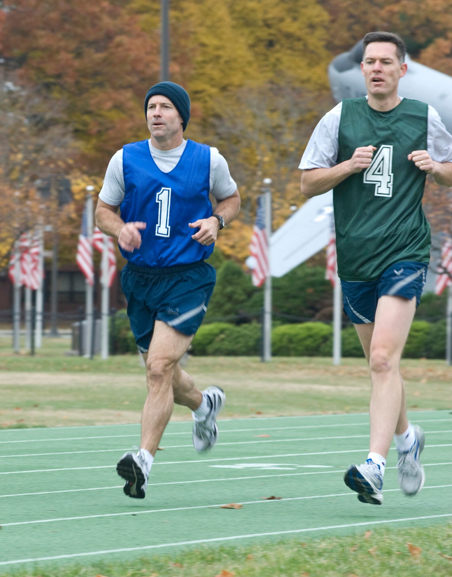 Col. Dave Orr, 66th Air Base Wing commander, and Lt. Col. Andrew Nicklas, 642nd Electronic Systems Squadron deputy director, complete the 1.5 mile running requirement at the track during a physical training test session held for Hanscom's leadership Oct. 30.  (U.S. Air Force photo by Mark Herlihy)