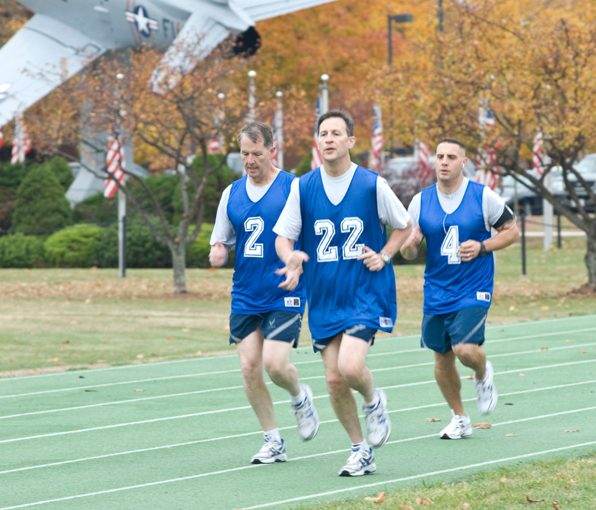 Hanscom leaders keep pace on the track as they fulfill the 1.5 mile timed-run portion of their physical training tests. Lt. Gen. Ted Bowlds, Electronic Systems Center commander; Col. Lee Pritchard, 66th Air Base Wing IMA to the commander and Master Sgt. John Carbon, 66th Security Forces Squadron first sergeant, participated in a PT test session held for base leadership on Oct. 30.  (U.S. Air Force photo by Mark Herlihy)