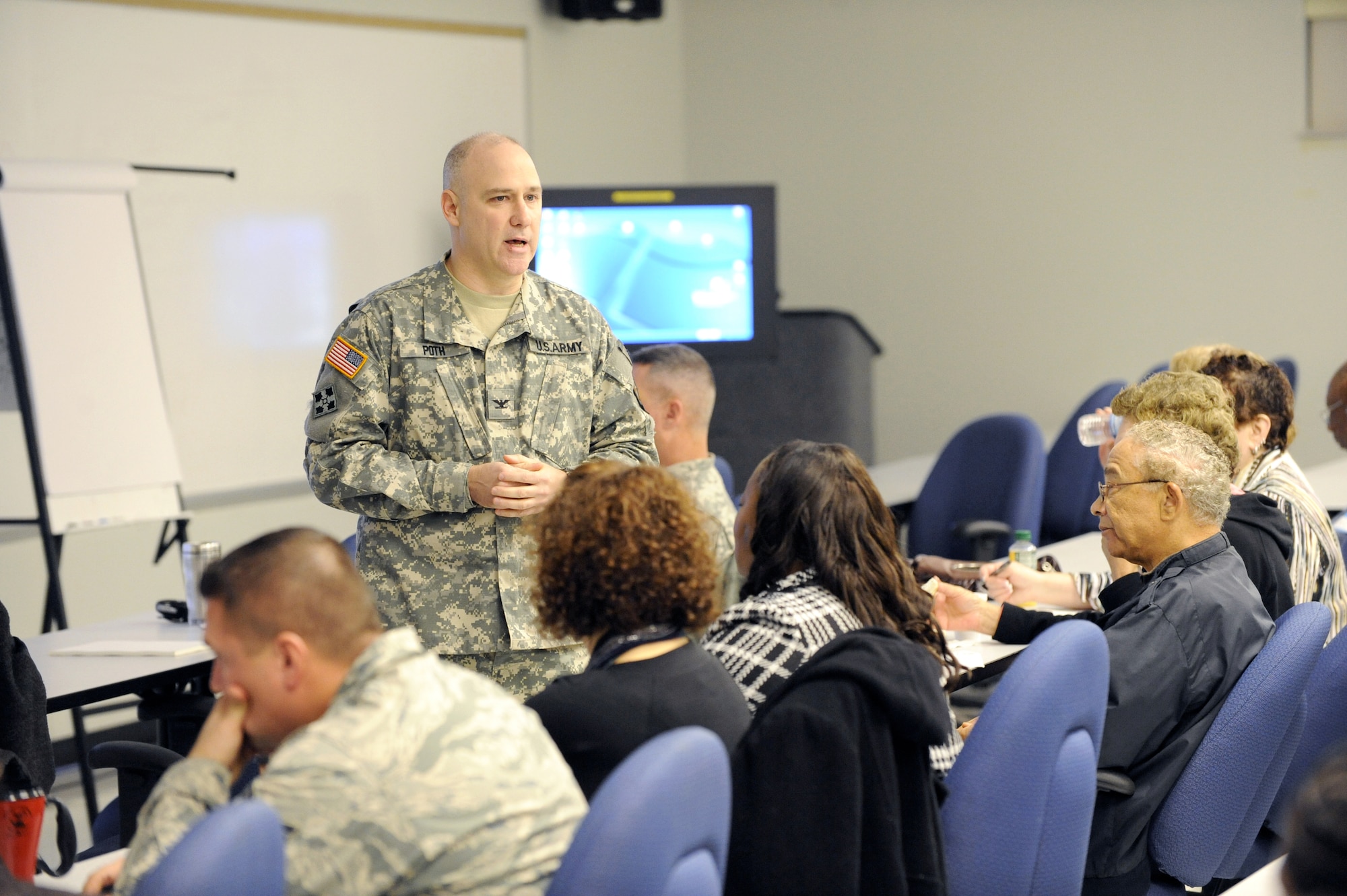 Col.Joe Poth, Joint Base McGuire-Dix-Lakehurst deputy commander, gives the opening remarks at the Military Family Action Plan Conference at the Timmerman Center here Oct. 29. “We need your ideas. We need your passion. We need your commitment. You can truly make a difference in the lives of families, servicemembers and the joint base,” he said. (U.S. Air Force Photo/Carlos Cintron)
