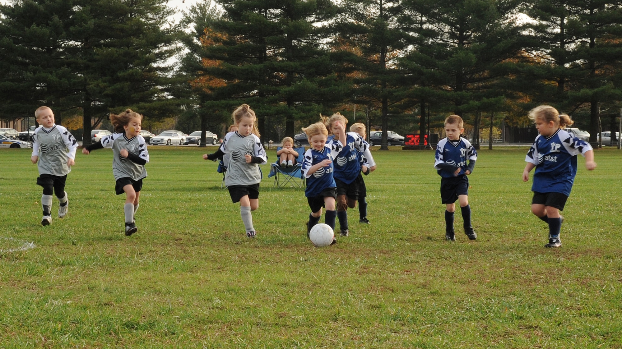 Soccer players plough through the mud and rain to compete in the final games of the Pee Wee League Saturday. Children interested in playing Youth Sports basketball  can now register at the Youth Center. (U.S. Air Force photo/Staff Sgt. Danielle Johnson)