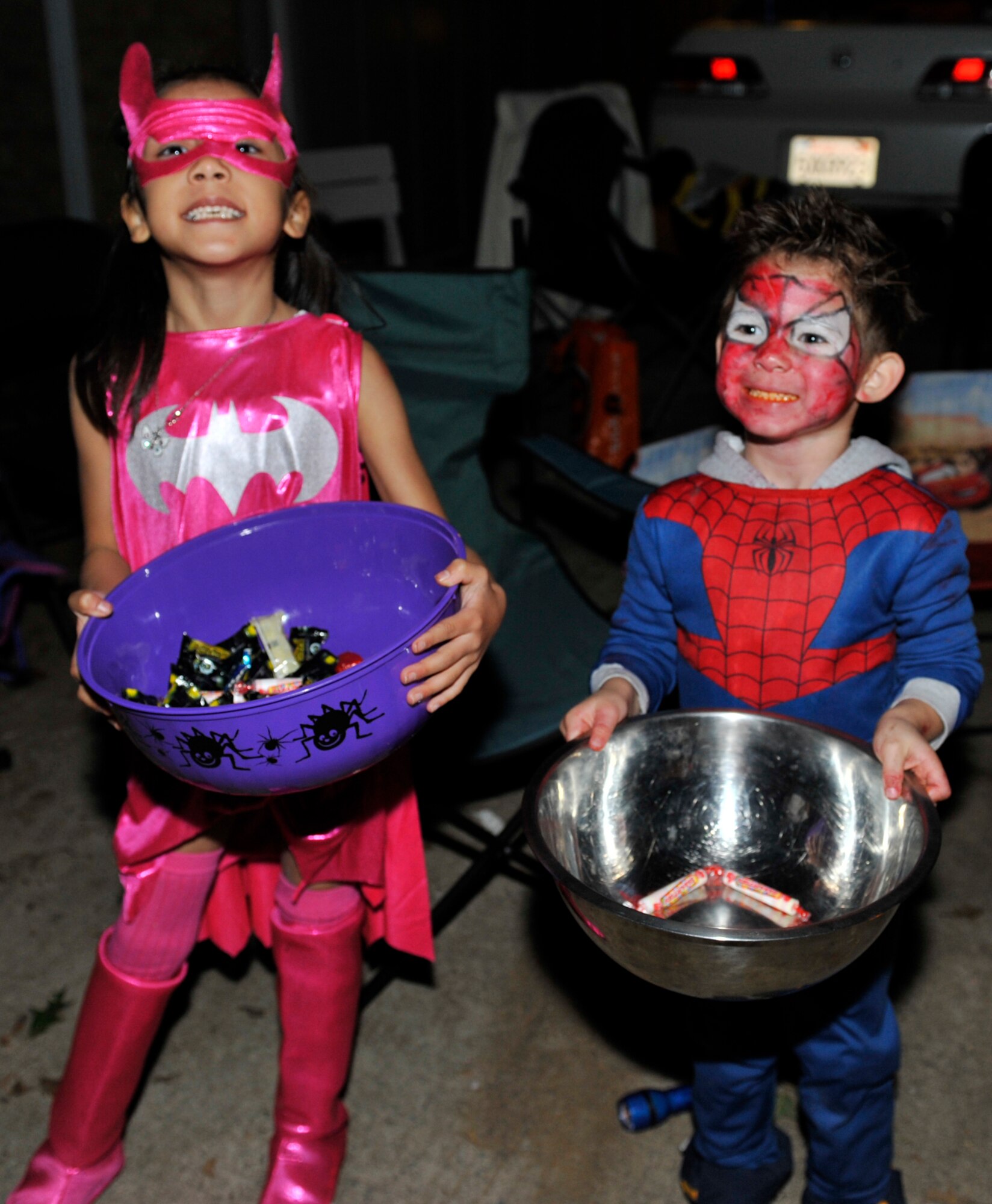 Children of base personnel pass out candy to trick-or-treaters in base housing Oct. 31. (U.S. Air Force photo by Airman 1st Class Lausanne Pacheco)