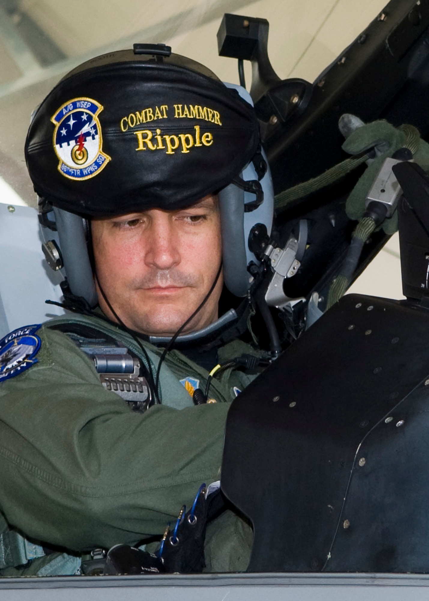 Lt. Col. Eugene Booth, 53rd Wing safety, straps into his F-16 before taking off with approximately 30 other aircraft to participate in the "Skull War" Oct. 30 at Eglin Air Force Base, Fla.  The "Skull War" is a large scale exercise ran by the 85th Test and Evaluation Squadron that provides test pilots the opportunity to fly operationally representative missions with test assets.  (U.S. Air Force photo/ Mike Lewis)