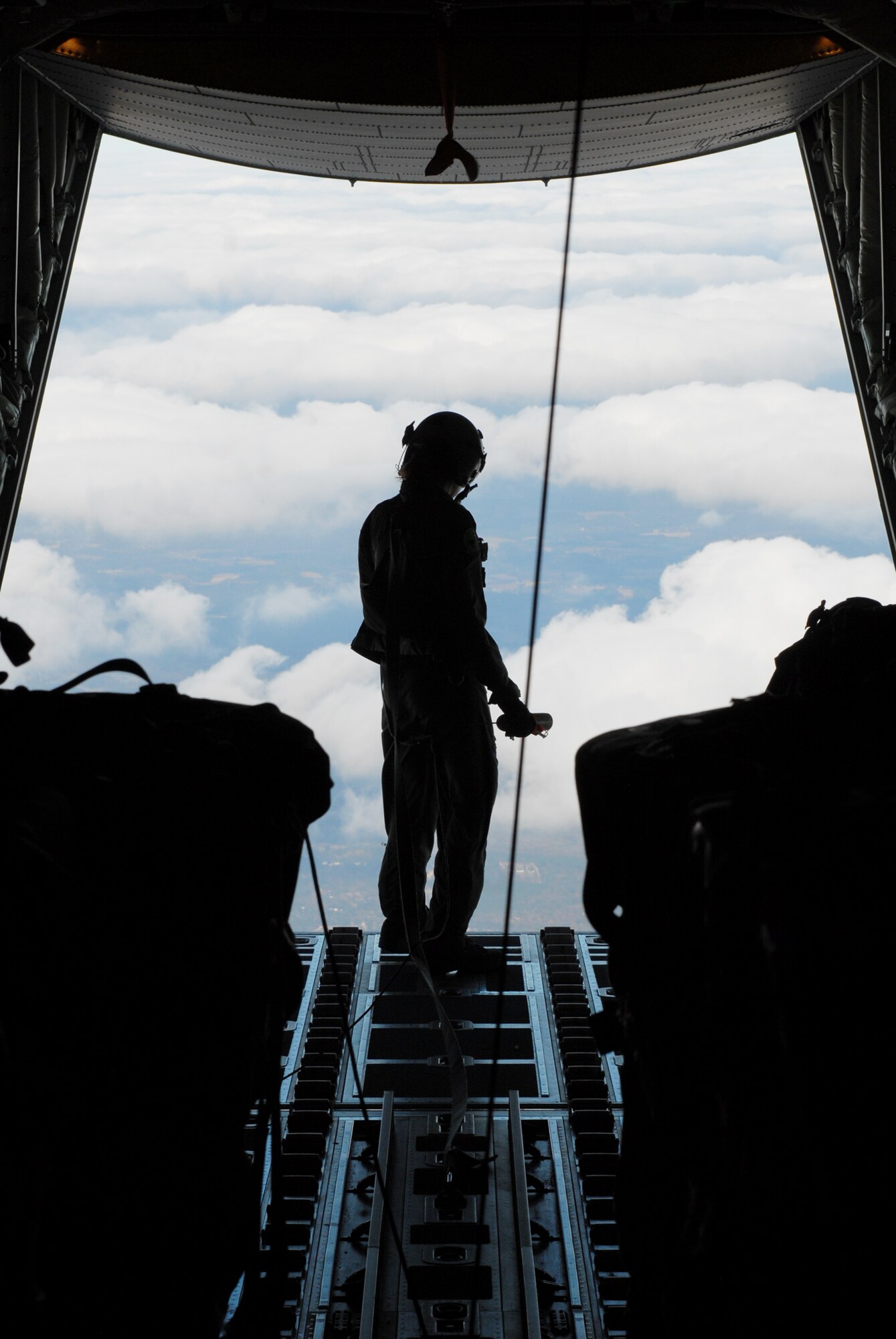 Senior Airman Erica Peschel prepares to deploy a dropsonde to measure weather conditions as part of Joint Forcible Entry Exercise 10-01 Oct. 29, 2009, at Pope Air Force Base, N.C. The JFEX focused on cohesive training between the Air Force and Army to reestablish forcible entry capability through airpower. Airman Peschel is a 41st Airlift Squadron loadmaster. (U.S. Air Force photo/Senior Airman Nathan Allen) 