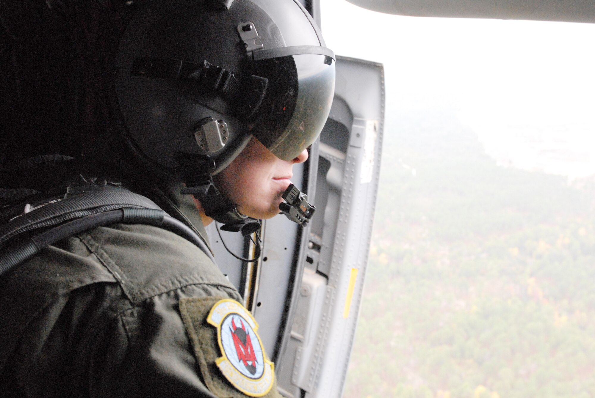 Senior Airman Bart Johnson surveys the terrain of the drop zone as part of Joint Forcible Entry Exercise 10-01 Oct. 28, 2009, at Pope Air Force Base, N.C. The JFEX focused on cohesive training between the Air Force and Army to re-establish forcible entry capability through airpower. Airman Johnson is a 50th Airlift Squadron C-130H3 loadmaster from Little Rock AFB, Ark. (U.S. Air Force photo/Senior Airman Nathan Allen) 