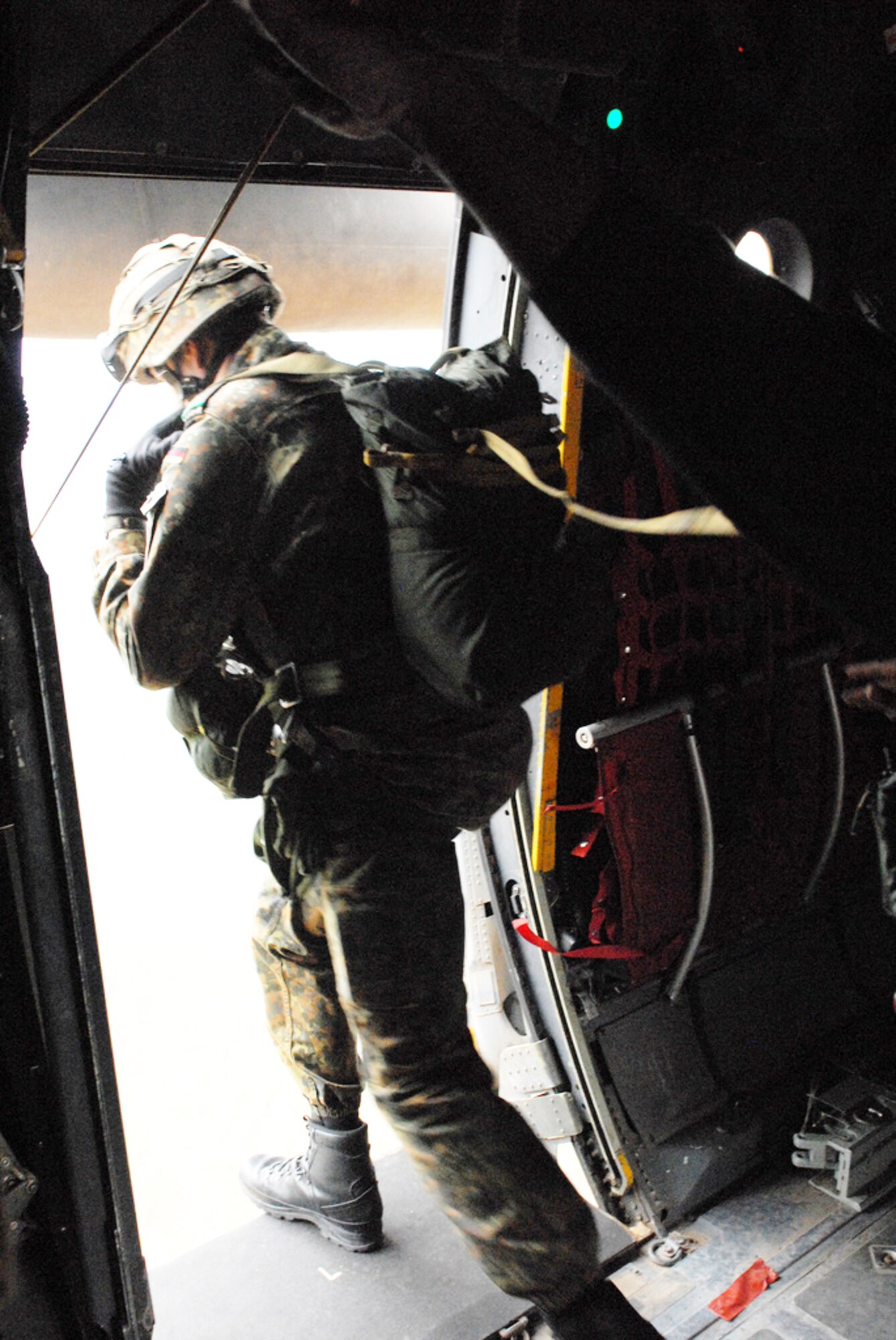 A German paratrooper training with the 82nd Airborne Division's Advanced Airborne school at Fort Bragg, N.C., jumps out of a C-130 Hercules as part of Joint Forcible Entry Exercise 10-01 Oct. 28, 2009, at Pope Air Force Base, N.C. The JFEX focused on cohesive training between the Air Force and Army to re-establish forcible entry capability through airpower. (U.S. Air Force photo/Senior Airman Nathan Allen) 