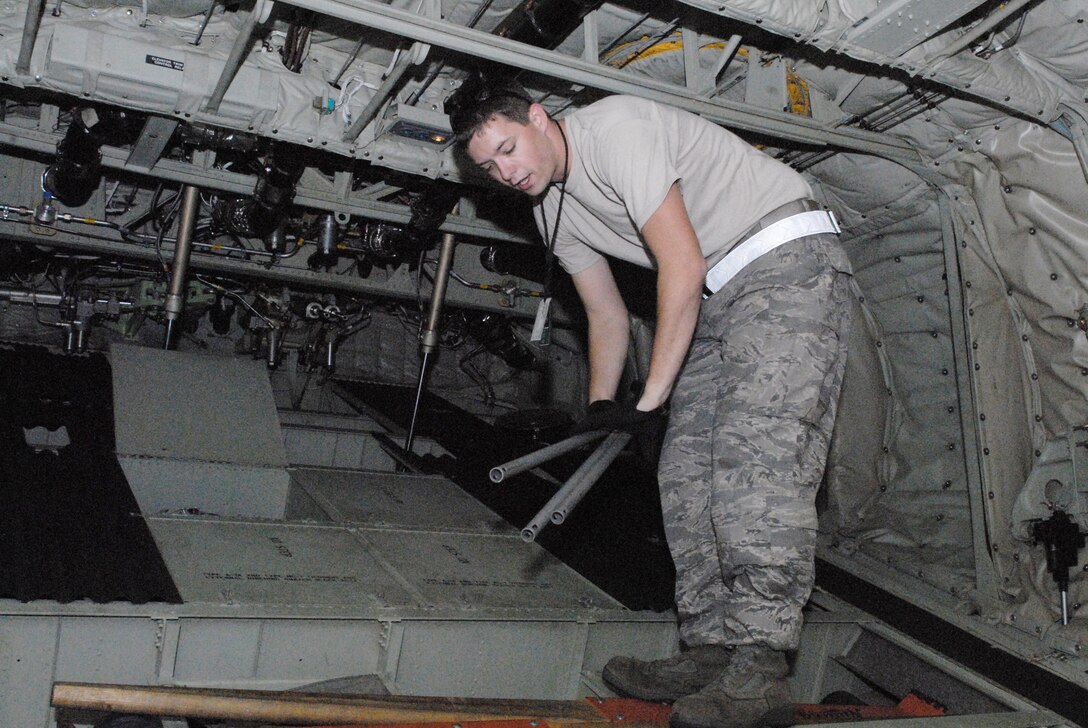 Senior Airman William Heptig stows jump cables during the preflight maintenance of a C-130 Hercules as part of Joint Forcible Entry Exercise 10-01 Oct. 28, 2009, at Pope Air Force Base, N.C. The JFEX focused on cohesive training between the Air Force and Army to re-establish forcible entry capability through airpower. Airman Heptig is a 19th Aircraft Maintenance Squadron crew chief from Little Rock AFB, Ark. (U.S. Air Force photo/Senior Airman Nathan Allen) 