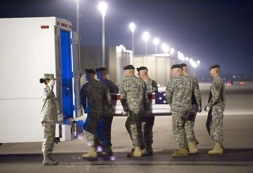 2 November 2009  USAF Photo by Jason Minto.  A U.S. Army carry team transfers the remains of Army Pfc. Lukas C. Hopper., of Merced, CA., at Dover Air Force Base, Del., Nov 2, 2009. Pfc. Hopper died Oct. 30, southeast of Karadah, Iraq, of injuries sustained during a vehicle roll-over. He was assigned to the 1st Battalion, 505th Parachute Infantry Regiment, 3rd Brigade Combat Team, 82nd Airborne Division, Fort Bragg, N.C.