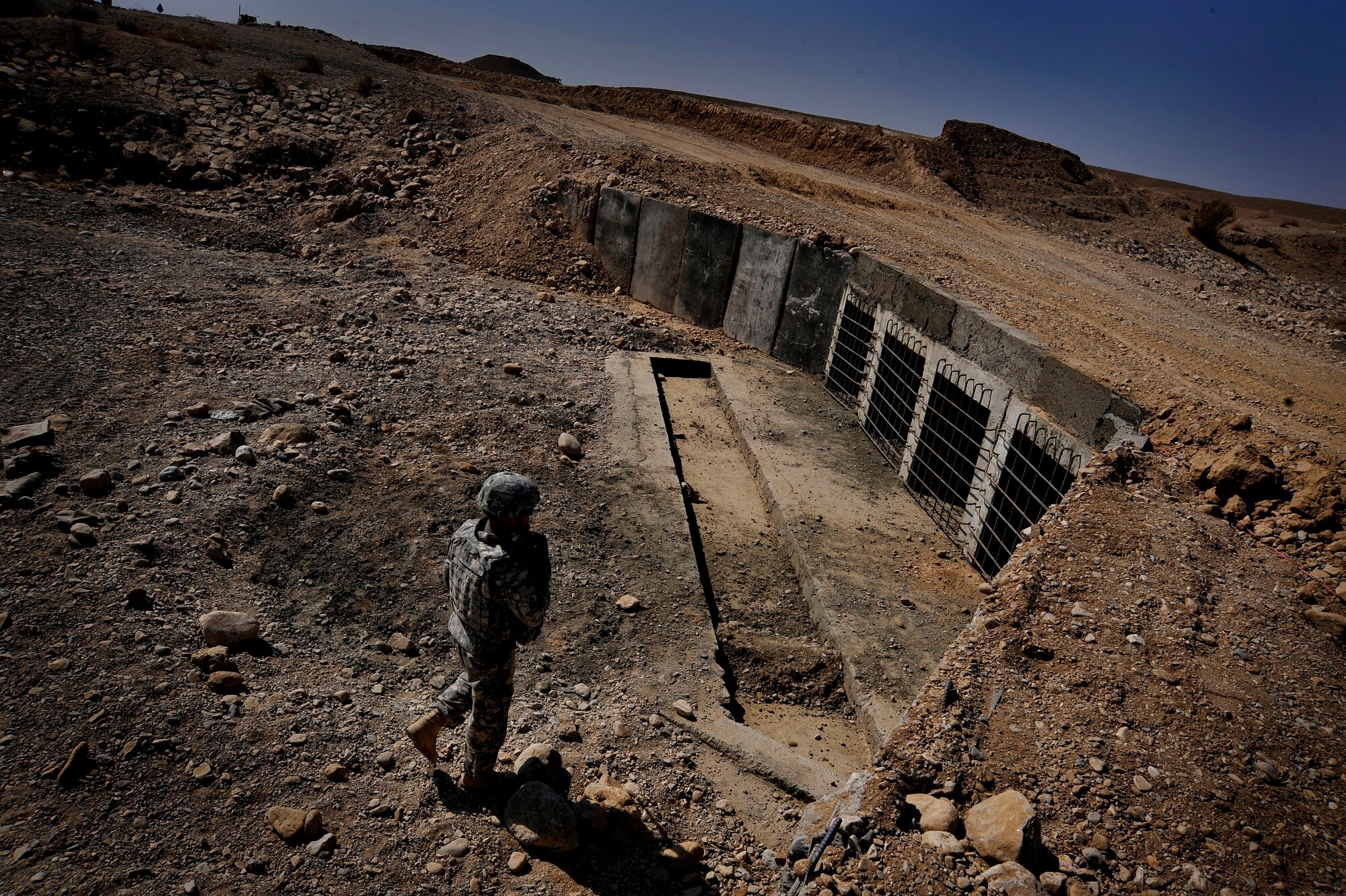 Capt. Rick Vermillion inspects a bridges for improvised explosives devices, damages or traces of tampering Oct. 23, 2009, in Zabul Province, Afghanistan. The inspections provide safety to the people of Zabul as well as coalition forces while traveling. Captain Vermillion is an engineer assigned to Provincial Reconstruction Team Zabul. (U.S. Air Force photo/Staff Sgt. Angelita Lawrence) 
