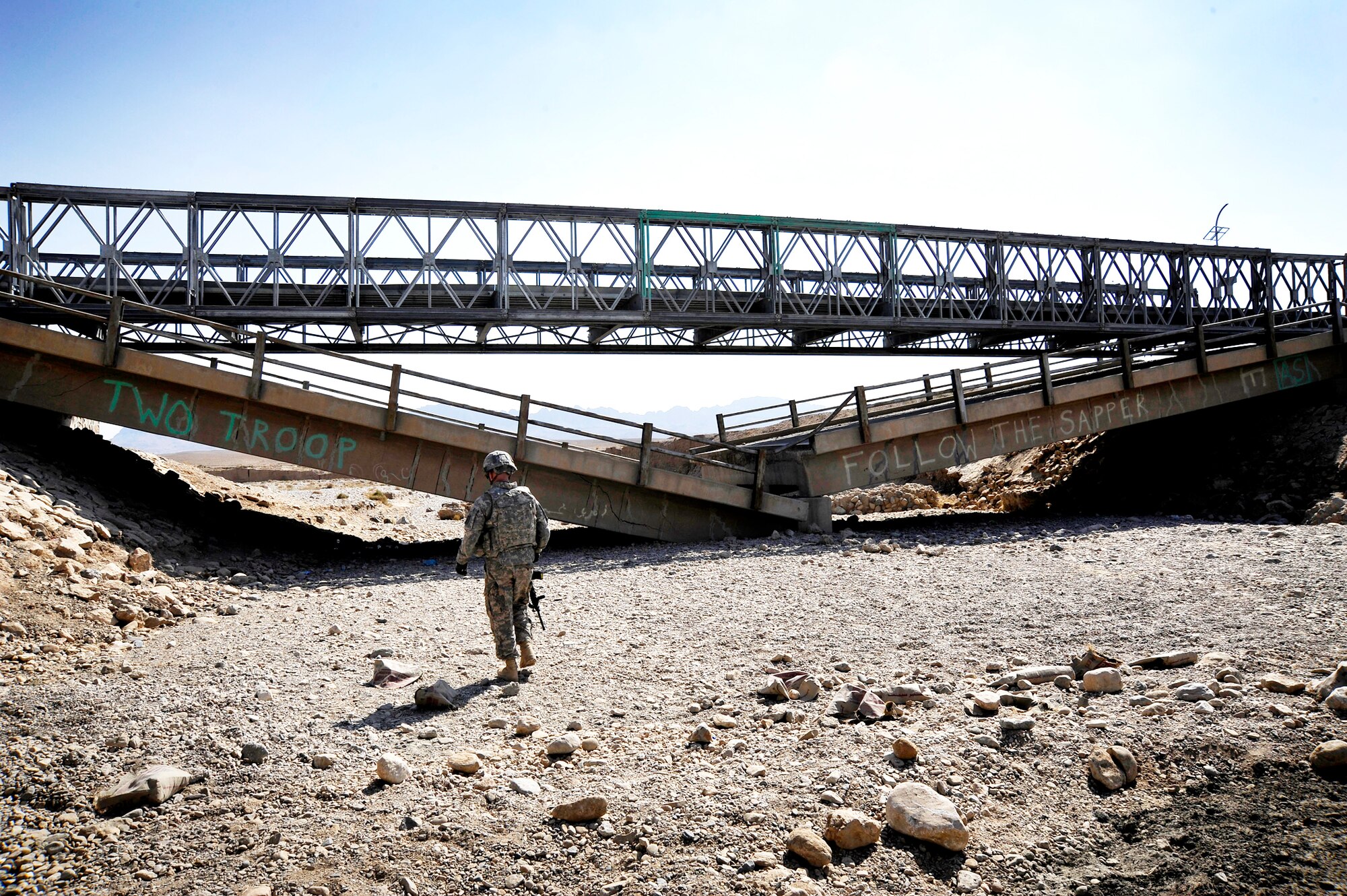 Capt. Rick Vermillion approaches a damaged bridge which he will inspect for improvised explosives devices or any traces of tampering Oct. 23, 2009, in Zabul Province, Afghanistan. The inspections provide safety to the people of Zabul as well as coalition forces while traveling. Captain Vermillion is an engineer assigned to Provincial Reconstruction Team Zabul. (U.S. Air Force photo/Staff Sgt. Angelita Lawrence) 
