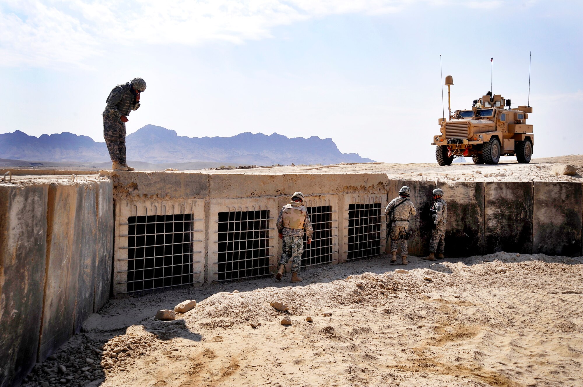 U.S. servicemembers from Provincial Reconstruction Team Zabul inspects a bridge for improvised explosive devices, damages or traces of tampering here Oct. 23, 2009, in Zabul Province, Afghanistan. The inspections increase safety for the people of Zabul as well as coalition forces while traveling. (U.S. Air Force photo/Staff Sgt. Angelita Lawrence)