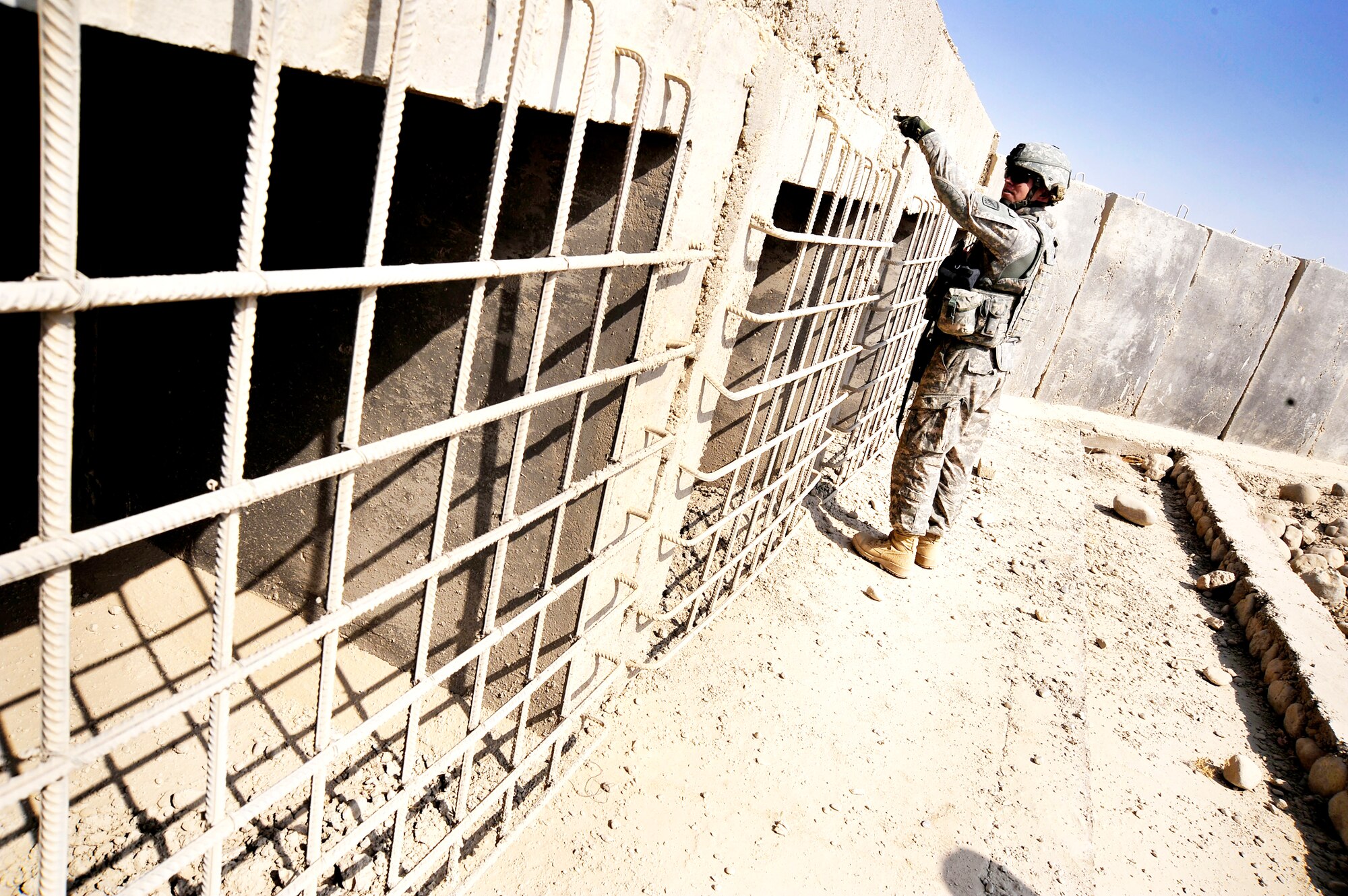Capt. Rick Vermillion inspects a bridges for improvised explosives devices, damages, or traces of tampering Oct. 23, 2009, in Zabul Province, Afghanistan. The inspections provide safety to the people of Zabul as well as coalition forces while traveling. Captain Vermillion is an engineer assigned to Provincial Reconstruction Team Zabul. (U.S. Air Force photo/Staff Sgt. Angelita Lawrence) 
