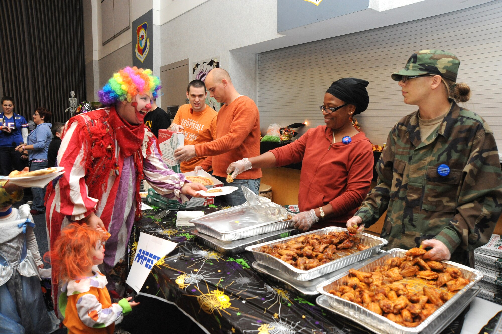 Team McConnell members enjoy food during the Neowallah Ball at McConnell Air Force Base, Kan., Oct. 30, 2009. Neowallah Ball is an annual Halloween festival for Team McConnell members. More than 28 volunteers assisted with the event by providing set-up, serving food, running games and clean-up. (U.S. Air Force photo by Tech. Sgt. Chyrece Campbell)