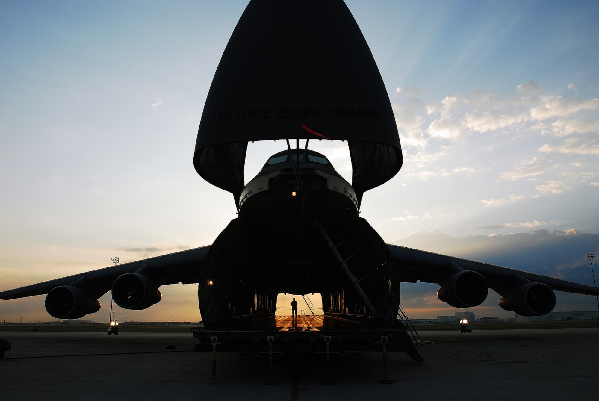 A C-5A Galaxy cargo aircraft assigned to Air Force Reserve Command's 433rd Airlift Wing "yawns" before sunrise May 22, 2009, on the flightline at Lackland Air Force Base, Texas. The fiscal 2010 National Defense Authorization Act directs the Air Force to halt plans to retire its C-5A's, to run more tests on the aircraft and to present a report to Congress giving reasons for keeping the older C-5s or mothballing them in favor of a newer transport aircraft. (U.S. Air Force photo/Airman Brian McGloin)
