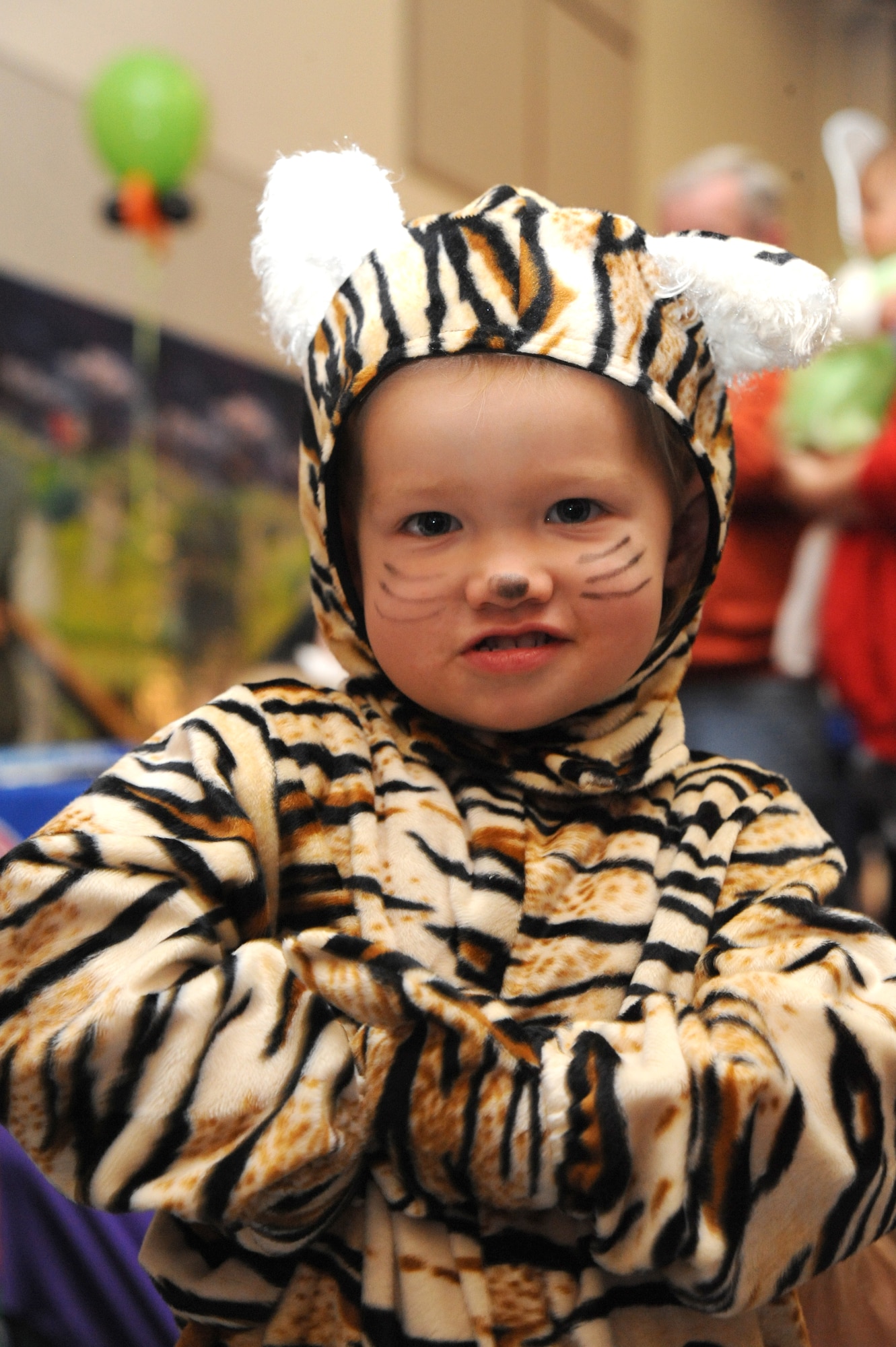 Allie Beckinhauer, 2, 22nd Operations Group family member, roars like a tiger during the Neowallah Ball at McConnell Air Force Base, Kan., Oct. 30, 2009. More than 700 Team McConnell members attended the party. The McConnell Youth Center has hosted this event since 2001. (U.S. Air Force photo by Tech. Sgt. Chyrece Campbell)