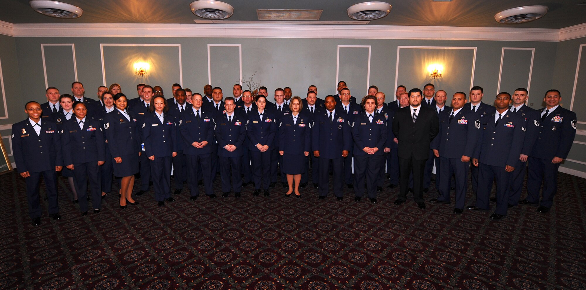 OFFUTT AIR FORCE BASE, Neb. - Forty-seven of Offutt's 132 Fall 2009 Community College of the Air Force graduates pose for a photo before a CCAF graduation ceremony at the Patriot Club here Oct. 30. U.S. Air Force Photo by Josh Plueger