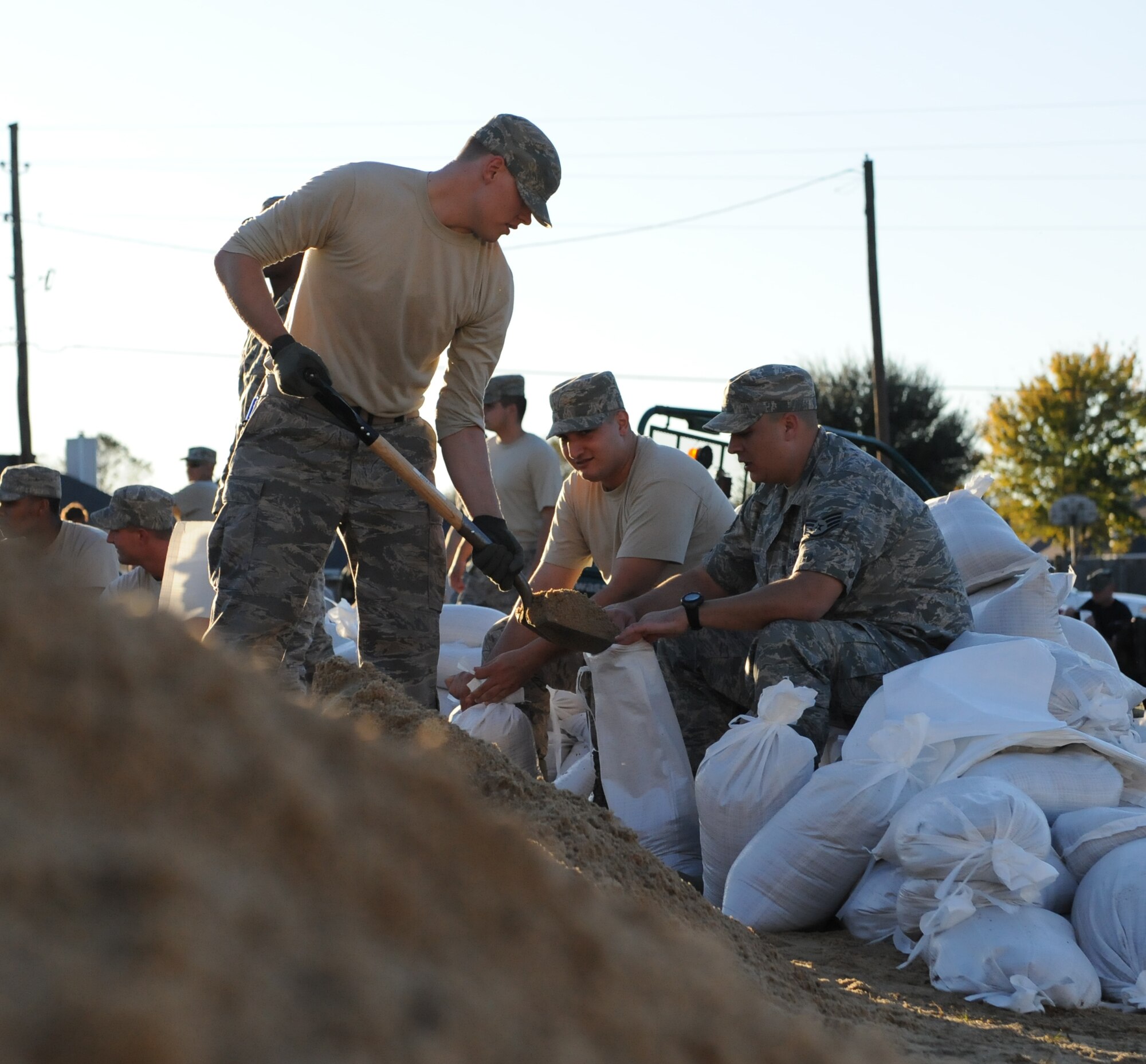 Airmen from Barksdale Air Force Base fill sandbags for a levee to hold back floodwaters in Bossier City, La. The Airmen, at the request of state and local officials, have been working nonstop since early Saturday morning to reinforce the levee containing Red Chute Bayou. More than 400 Airmen have assisted with filling and hauling sandbags in a massive effort under immediate response authority. (U.S. Air Force photo by Maj. Carie Parker) 