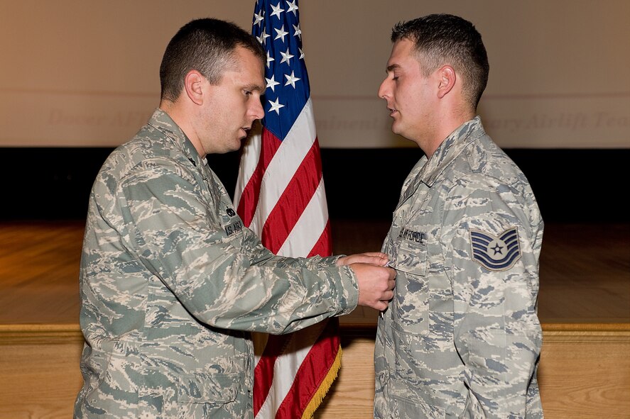 Tech. Sgt. Jimmy Heater, 436th Logistics Readiness Squadron, receives a Bronze Star medal from Lt. Col. Sean Tyler, 436th LRS commander, Oct. 30 at the 436th LRS commander's call. Sergeant Heater was awarded the Bronze Star for meritorious service while deployed as a convoy commander in support of Operation Iraqi Freedom.  (U.S. Air Force photo/Roland Balik)