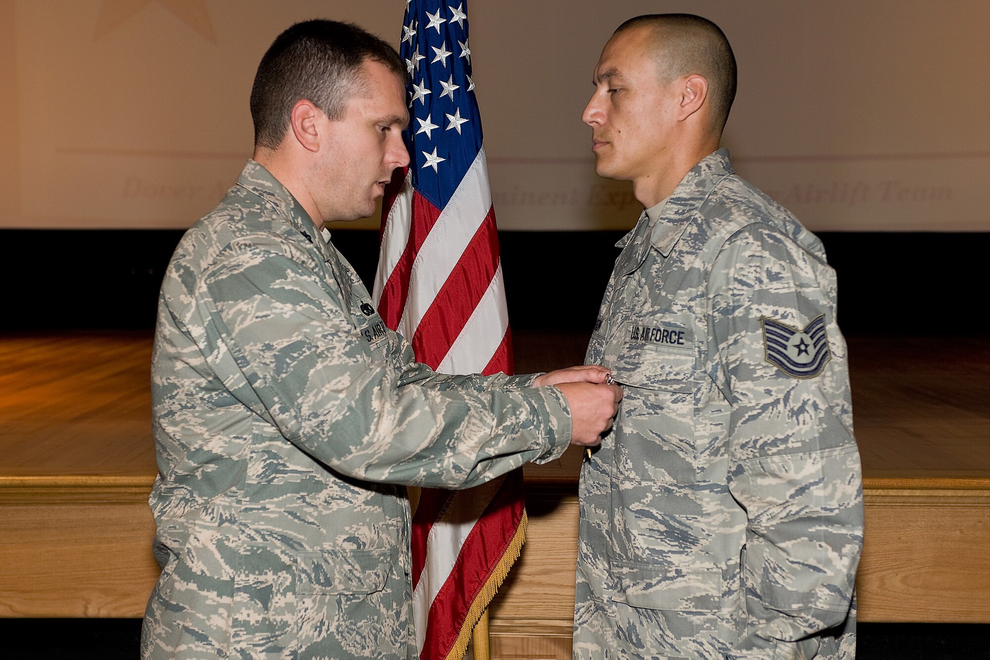 Tech. Sgt. Paul Nelson, 436th Logistics Readiness Squadron, receives a Bronze Star Medal from Lt. Col. Sean Tyler, 436th LRS commander, Oct. 30 at the 436th LRS commander's call. Sergeant Nelson was awarded the Bronze Star for meritorious service while deployed as a mentor for the Afghan Army's heavy company commanders. (U.S. Air Force photo/Roland Balik)