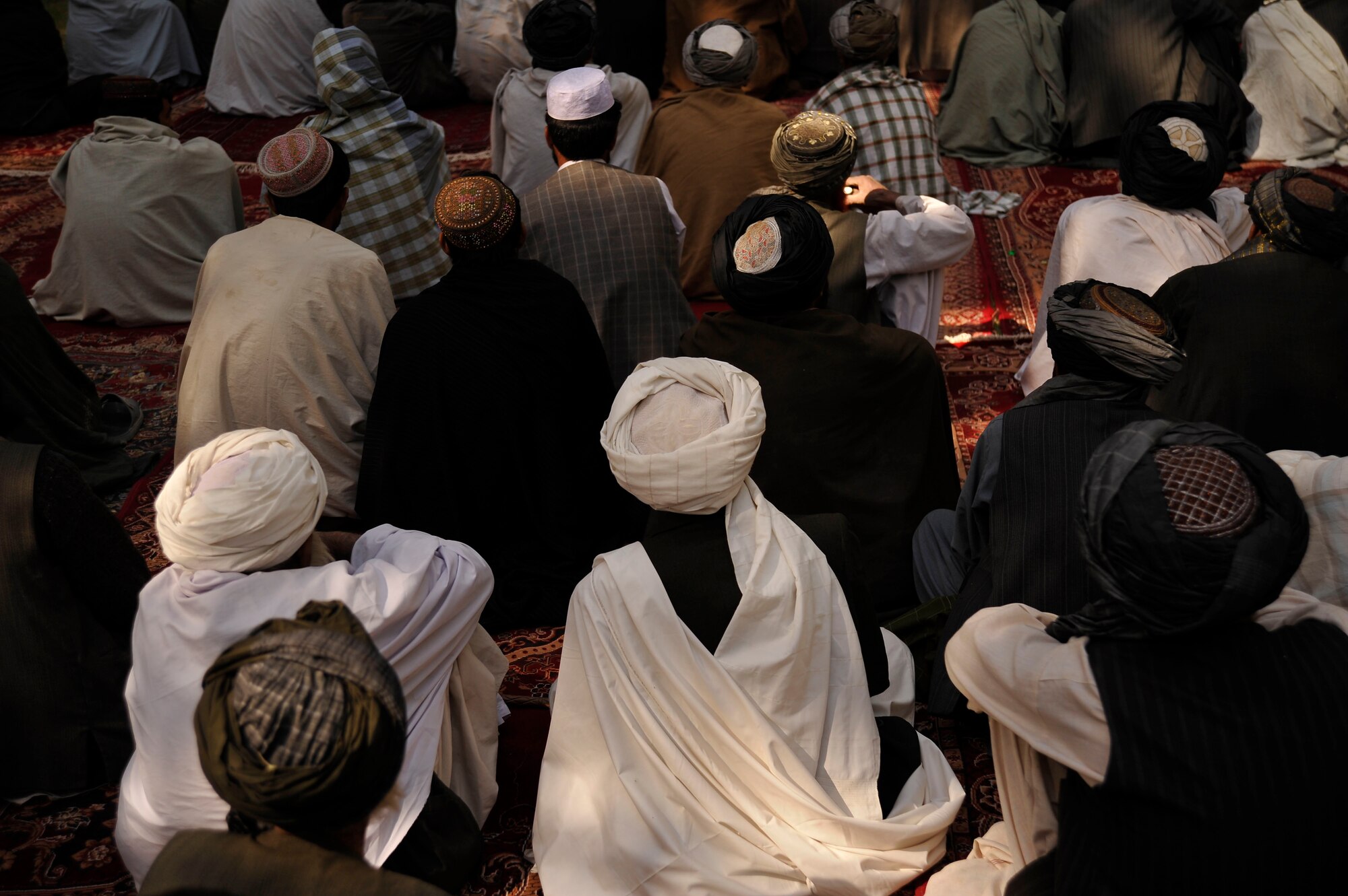 Citizens from Shar-E-Safa, in Afghanistan's Zabul Province, listen to their provincial governor speak at a gathering here Oct. 23, 2009. The governor is encouraging people to vote so they can improve their county. Military servicemembers from the United States helped coordinate and provided security at the event. (U.S. Air Force photo/Staff Sgt. Angelita Lawrence)