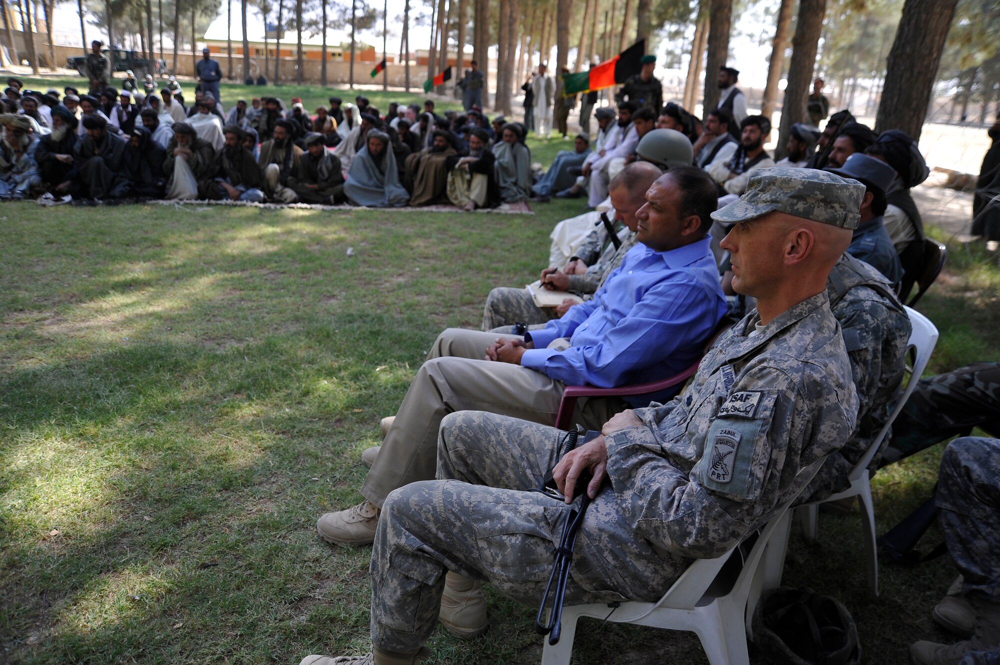 U.S. Air Force Lt. Col. Andy Veres, Commander of Provincial Reconstruction Team Zabul, listens to speakers tell the residents of Shar-e-Safa about their voting rights here Oct. 23, 2009. The governor of Zabul Province is encouraging people to vote so they can improve their county. (U.S. Air Force photo/Staff Sgt. Angelita Lawrence)
