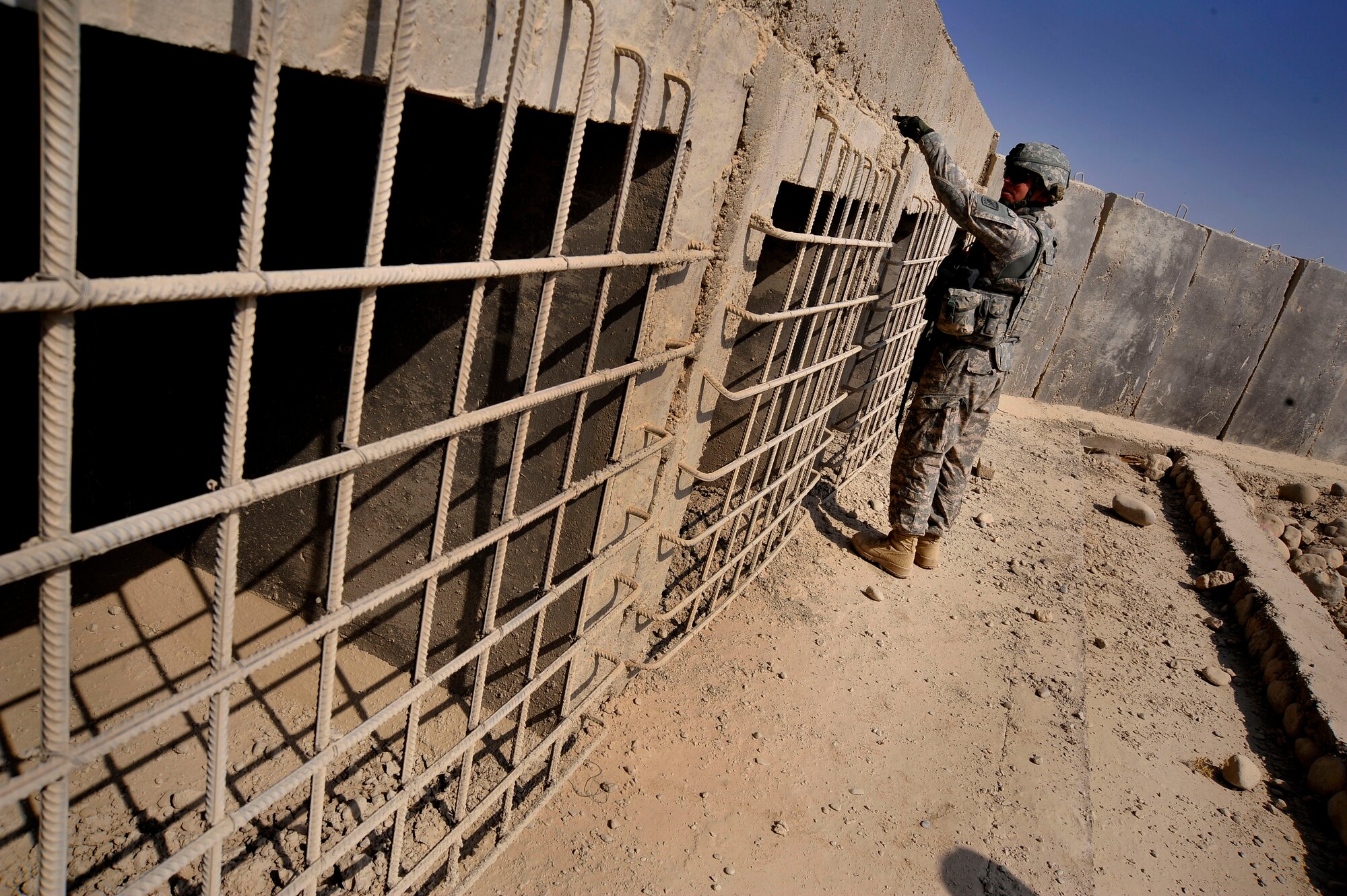 U.S. Air Force Capt. Rick Vermillion, a civil engineer assigned to Provincial Reconstruction Team Zabul, inspects a bridge for improvised explosive devices, damages, or traces of tampering here Oct. 23, 2009.  The inspections increase safety for the people of Zabul as well as coalition forces while traveling. (U.S. Air Force photo/Staff Sgt. Angelita Lawrence)
