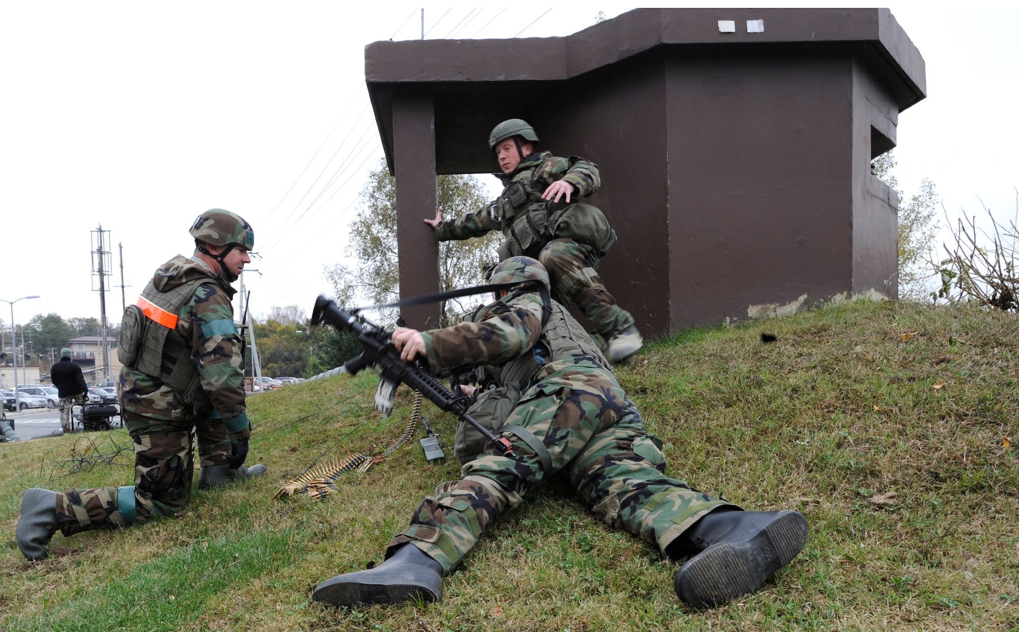 51st Security Forces Airmen guard the base and fight off opposing forces near the 51st Fighter Wing headquarters building during operational readiness exercise Beverly Midnight 09-02 at Osan Air Base, Republic of Korea, Nov. 3. (U.S. Air Force photo by Senior Airman Stephenie Wade)

