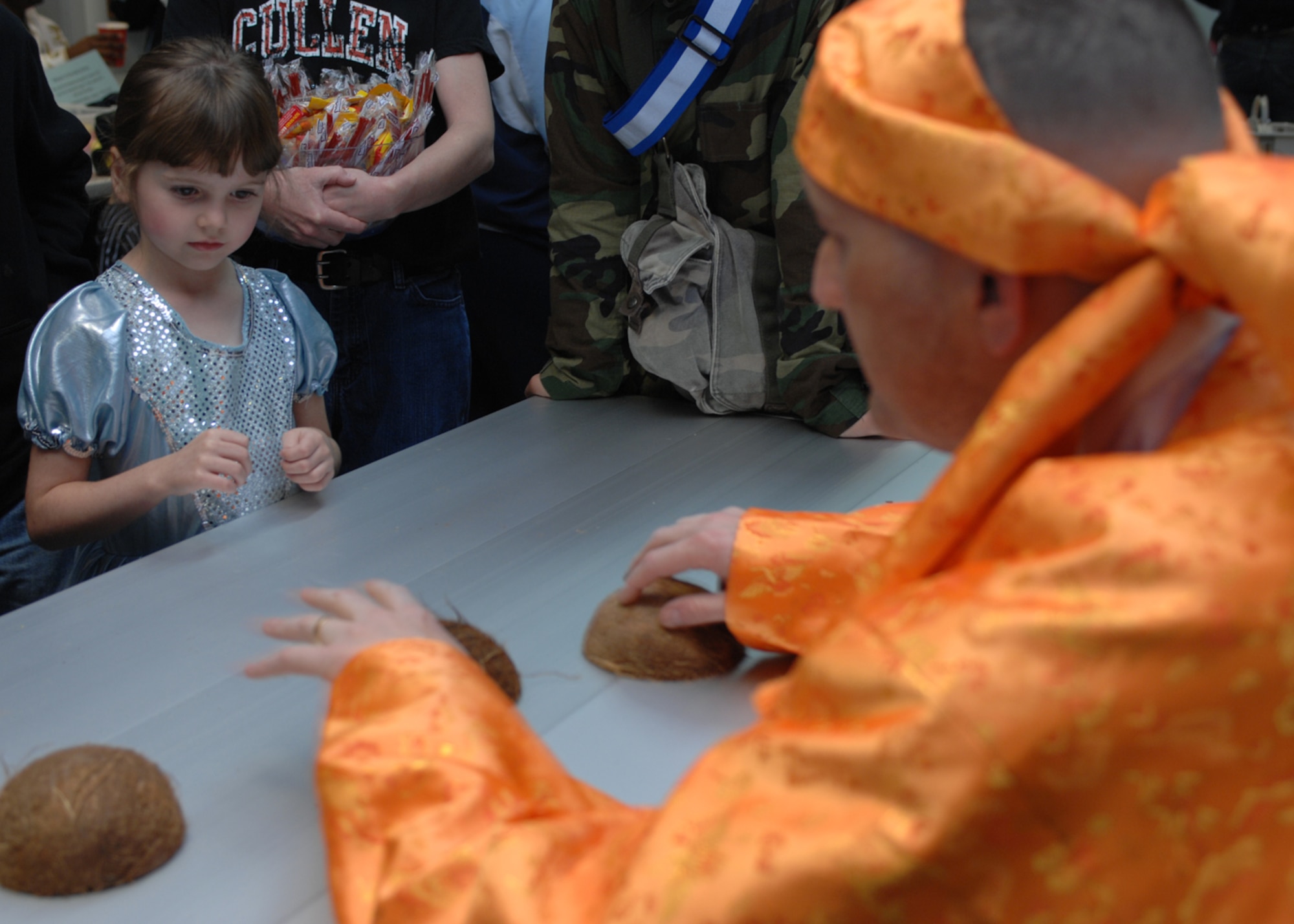 Kayla Schill, daughter of Tech. Sgt. Adam Schill, 39th Operations Squadron, chooses a coconut during a shell game at the chapel harvest festival Saturday, Oct. 31, 2009, at Incirlik Air Base, Turkey. The theme of the evening was ‘Walking through the Bible’ and was the Chapel’s alternative to secular Halloween celebrations. More than 300 people participated in arts and crafts and activities based on Bible stories. (U.S. Air Force photo/Staff Sgt. Lauren Padden)