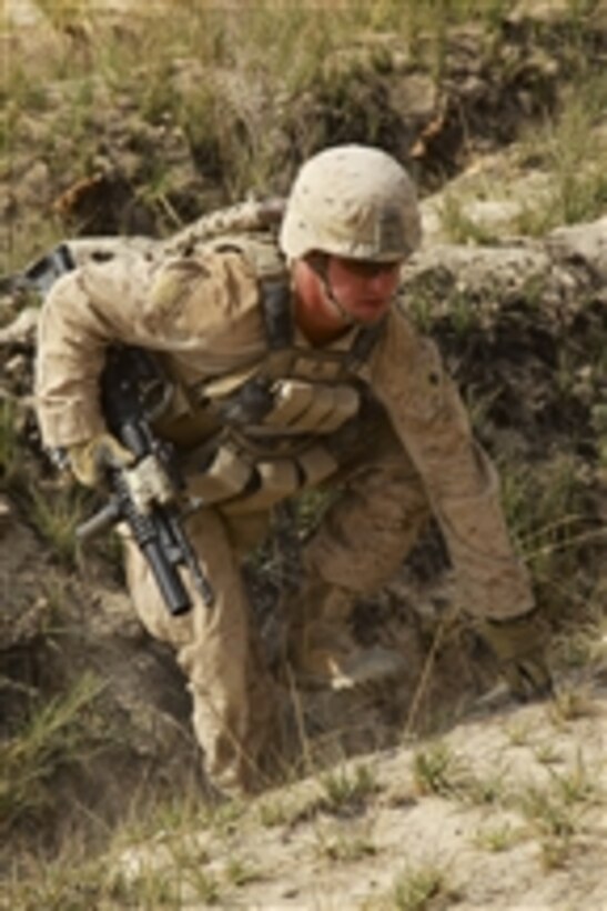 U.S. Marine Corps Sgt. Andy Lee, with Combined Anti-Armor Team, 1st Battalion, 5th Marine Regiment, climbs a hill during a security patrol through the Nawa district of Helmand province, Afghanistan, on Oct. 26, 2009.  Marines conduct security patrols to decrease insurgent activity and gain the trust of the Afghan people.  The Marines are deployed with Regimental Combat Team 3 to conduct counterinsurgency operations with Afghan National Security Forces in southern Afghanistan.  