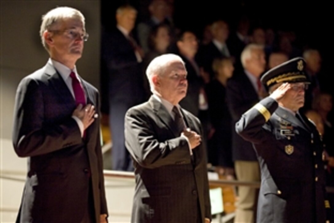 Left to right, Army Secretary John McHugh, Defense Secretary Robert M. Gates and Army Chief of Staff Gen. George W. Casey Jr. render honors during the playing of the national anthem during a welcoming ceremony for McHugh on Fort Myer, Arlington, Va., Nov. 2, 2009. McHugh was sworn in as the 21st Army Secretary on Sept. 21, 2009.  