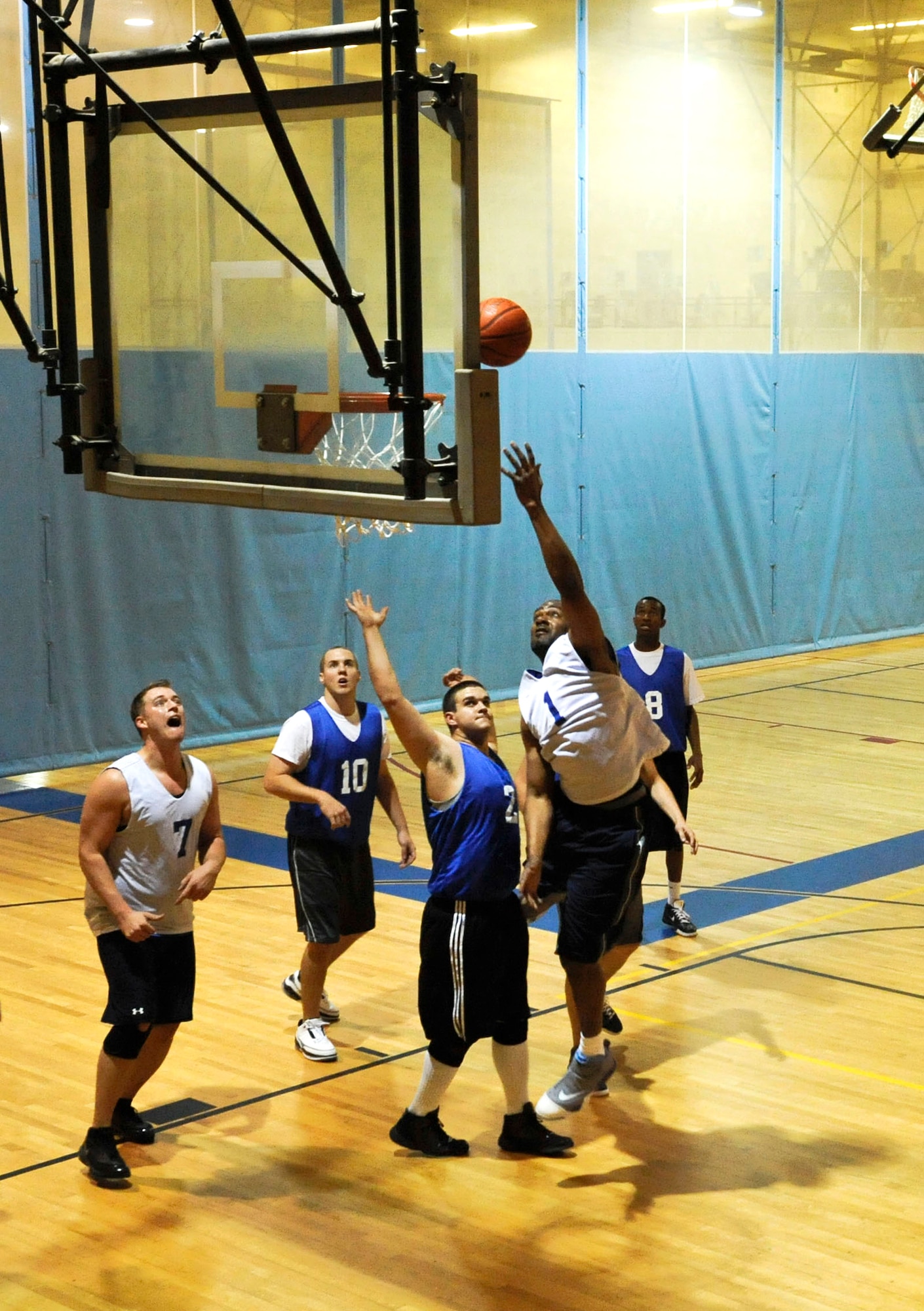 ELMENDORF AIR FORCE BASE, Alaska – A player from the U.S. Coast Guard, goes up for a layup over the 3rd Equipment Maintenance Squadrons Daniel Brooks, Nov. 3 at the Fitness center during a basketball game. The CG beat the 3rd EMS 43-40 with a three pointer as time expired. (U.S. Air Force photo/Airman 1st Class Christopher Gross)