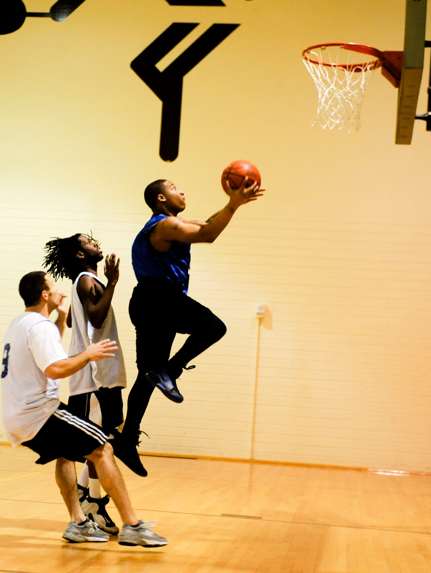 ELMENDORF AIR FORCE BASE, Alaska ? 3rd Equipment Maintenance Squadron?s David Rich takes the ball to the hoop after a break a way during a basketball game against the U.S. Coast Guard Nov. 3 at the Fitness Center. Both teams played hard to the very end. However it was the CG who came out on top with a game winning shot as time expired to beat the 3rd EMS 43-40.  (U.S. Air Force photo/Airman 1st Class Christopher Gross)