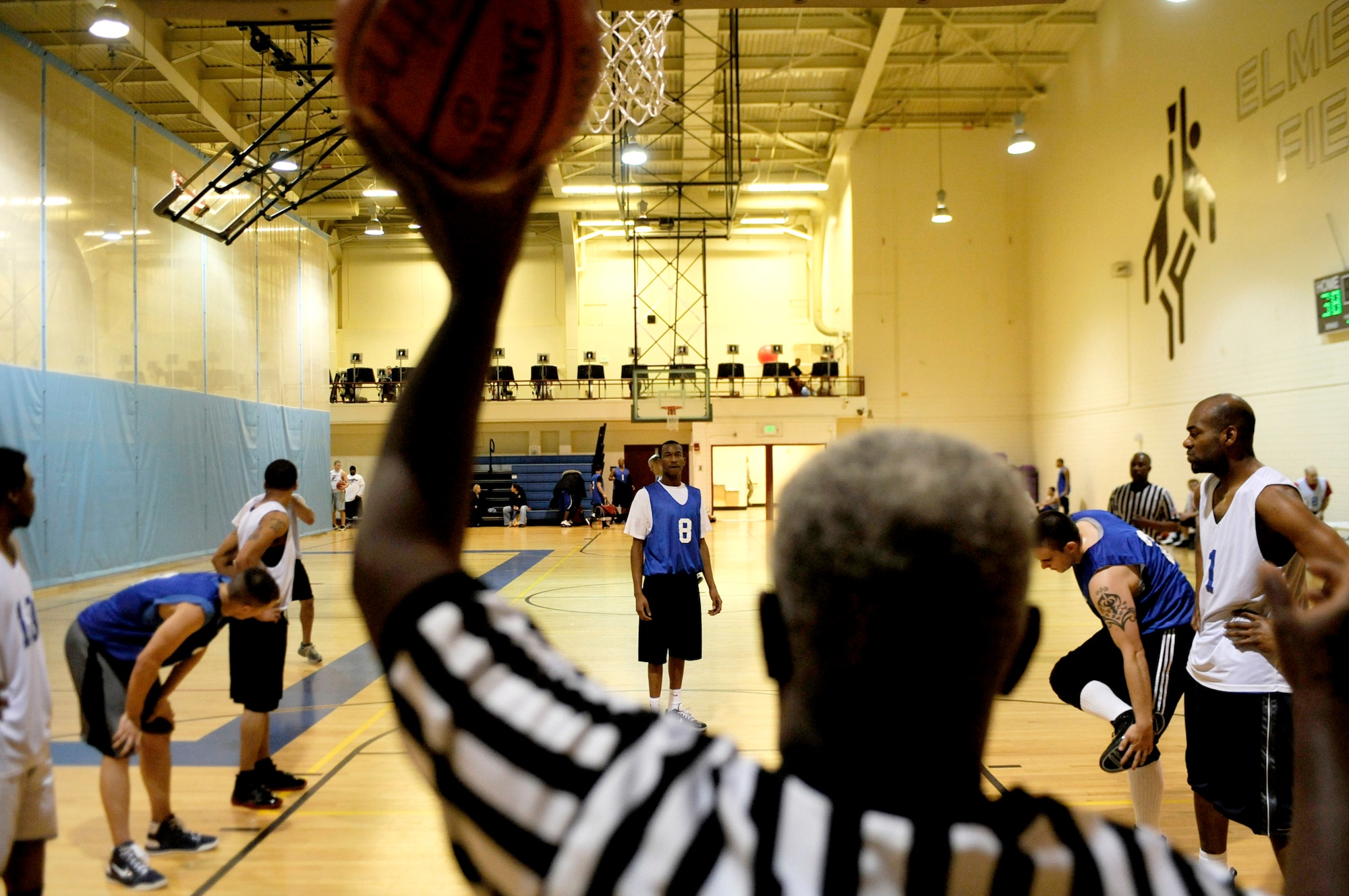 ELMENDORF AIR FORCE BASE, Alaska – The referee prepares to pass the ball to the 3rd Equipment Maintenance Squadron’s John Farmer so that he can attempt his free throws. The U.S. Coast Guard beat the 3rd EMS 43-40. Farmer scored nine of his teams’ total 40 points of the night. The 3rd EMS faced off against the CG Nov. 3 at the Fitness center in what was back and forth game. Although the CG came out on top with the CG hitting a game winning three pointer as time expired to go on top 43-40.  (U.S. Air Force photo/Airman 1st Class Christopher Gross)