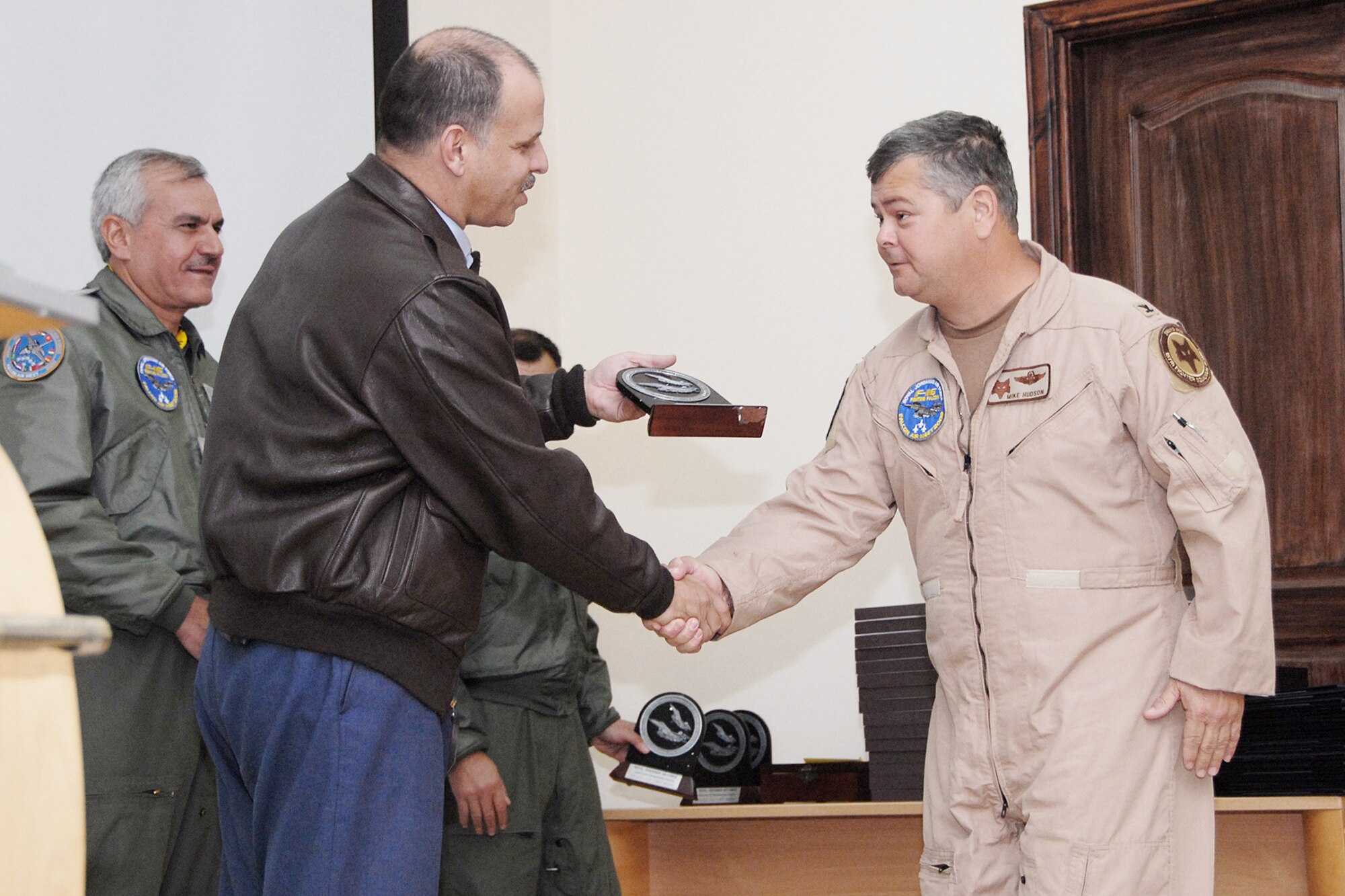 His Royal Highness Prince Feisal Bin Al Hussein presents a Falcon Air Meet 2009 award Nov. 3, 2009, to Col. Mike Hudson, commander of the South Carolina Air National Guard's 169th Operations Group based at McEntire Joint National Guard Base, S.C.  The unit represented the United States in the three-nation F-16 Fighting Falcon competition at Mwaffaq Salti Air Base, Jordan.  (U.S. Air Force photo/Tech. Sgt. Caycee Cook)