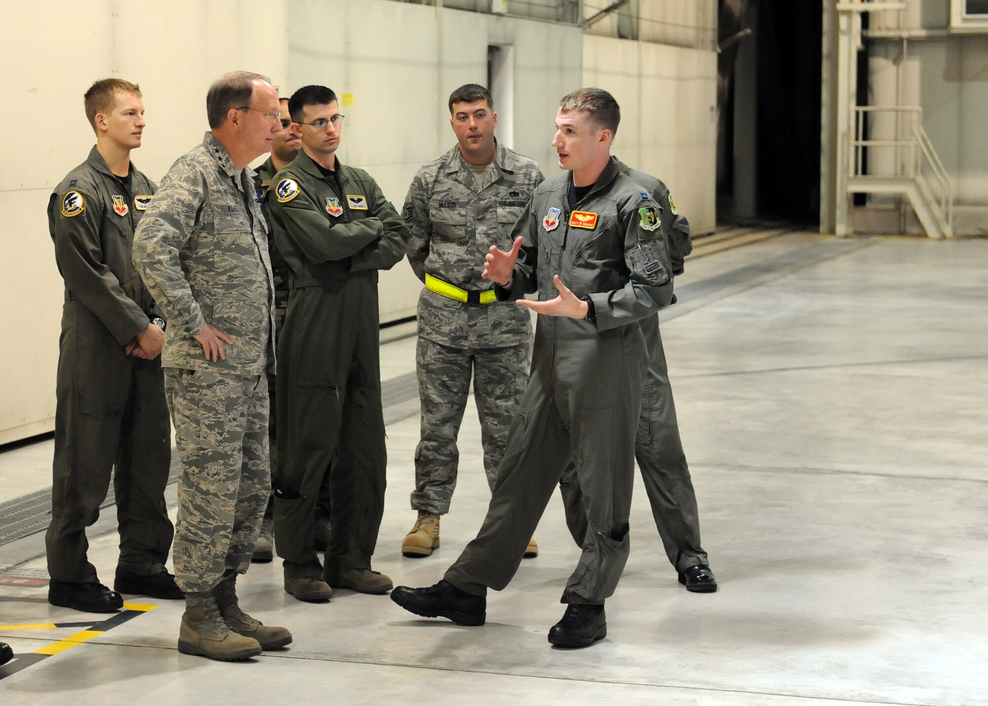 MINOT AIR FORCE BASE, N.D. -- Lt. Gen. Frank G. Klotz, Global Strike Command commander, discusses the capabilities of a B-52H Stratofortress with Maj. Andy Carter, 23rd Bomb Squadron radar navigator, while others look on here, Oct. 28. The general is here to meet members of Minot AFB and the local community. He is scheduled to be the featured speaker at the Minot Chamber of Commerce annual meeting and luncheon in Minot Oct. 29. (U.S. Air Force photo by Staff Sgt. Keith Ballard)